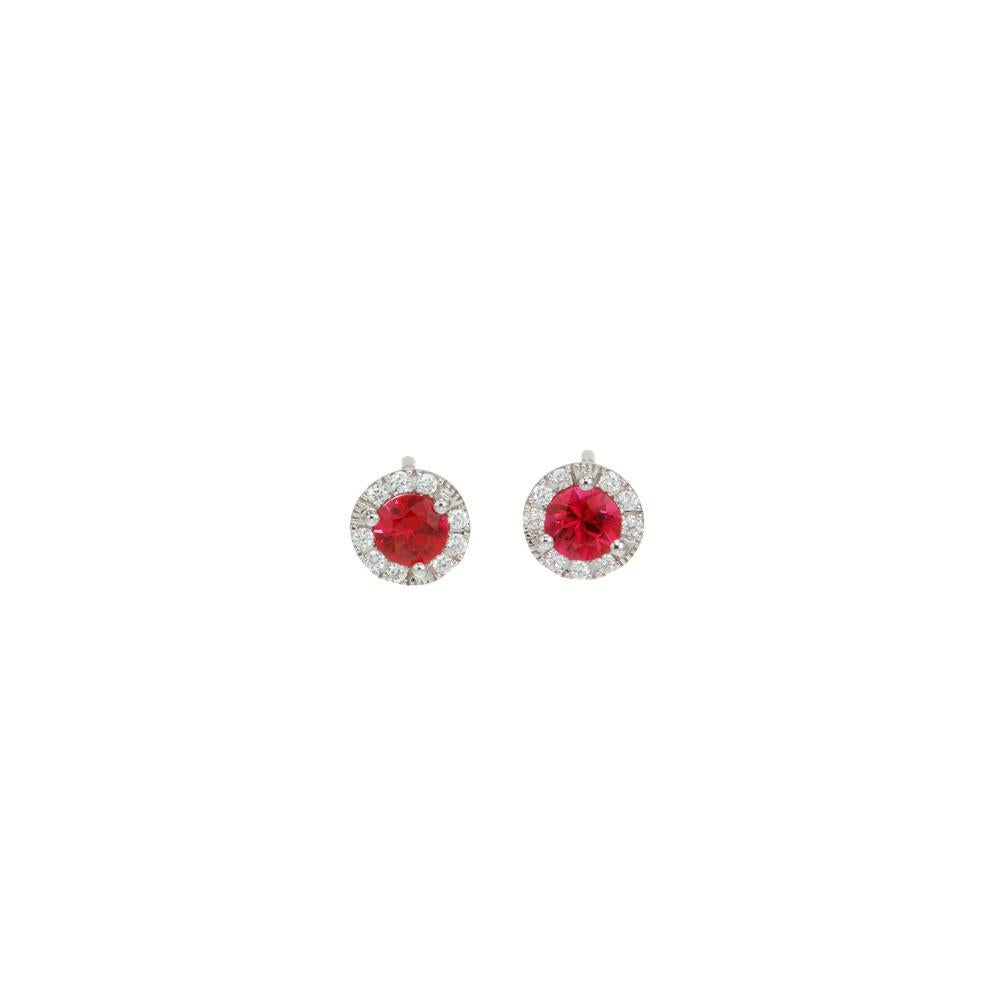Fine bright red ruby and diamond earrings. 2 bright red round rubies mounted in three prong 18k white gold settings with a halo of full cut diamonds. Designed and crafted in the Peter Suchy Workshop for daily or night time wear. 

2 round red