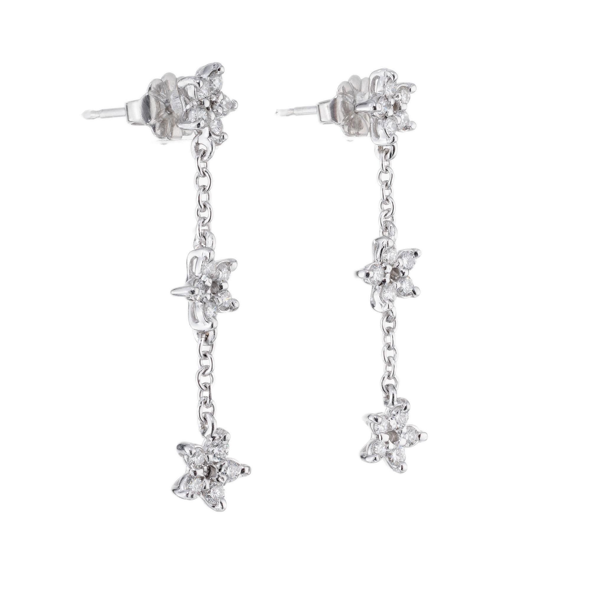Peter Suchy petite triple star diamond platinum dangle drop earrings, with 30 round brilliant cut diamonds. Created in the Peter Suchy Workshop.
30 round brilliant cut diamonds, F-G VS approx. .60cts
Platinum 
Stamped: PT950
3.6 grams
Top to bottom: