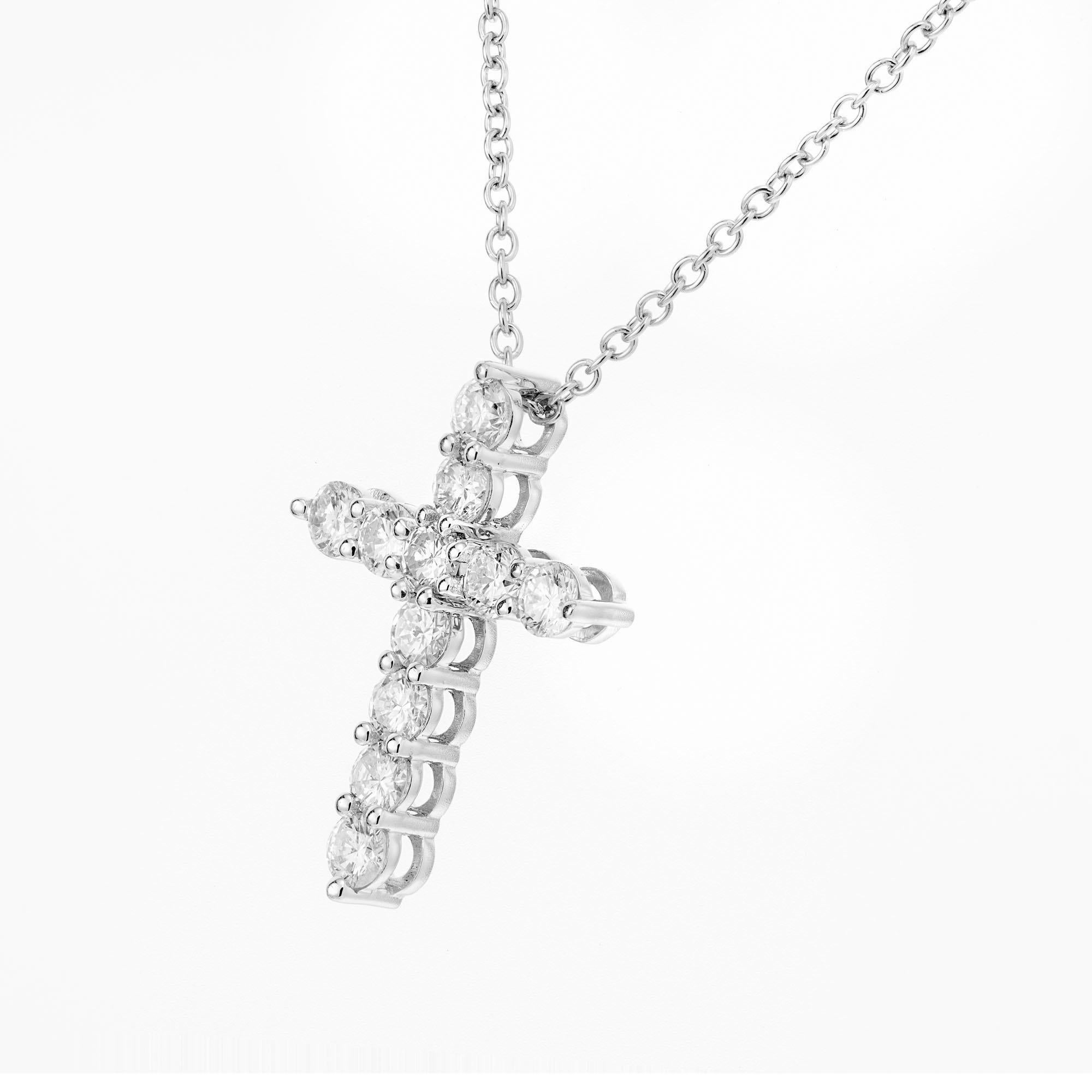 Peter Suchy .63 carat 11 round brilliant cut diamond cross in platinum on a 16 Inch platinum chain 

11 round brilliant cut diamonds, F-G VS approx. .63cts
Platinum 
Stamped: PT950
3.8 grams
Top to bottom: 18.5mm or .75 Inch
Width: 13.6mm or .5