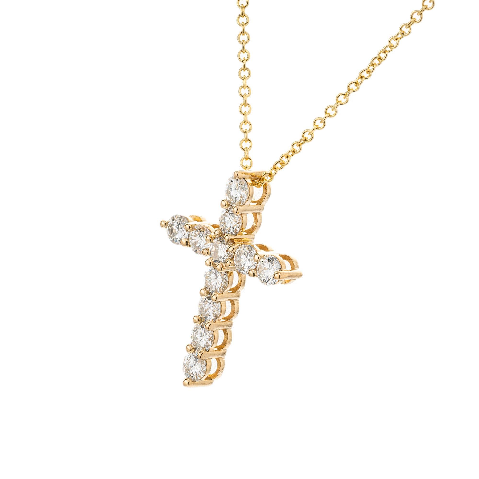 Peter Suchy .63 Carat Diamond cross pendant necklace in 18k yellow gold. 18 inch chain. 

11 round brilliant cut diamonds, G VS approx. .63cts
18k yellow gold 
Stamped: 750
2.6 grams
Top to bottom: 18.5mm or .75 Inch
Width: 13.5mm or .5 Inch
Depth