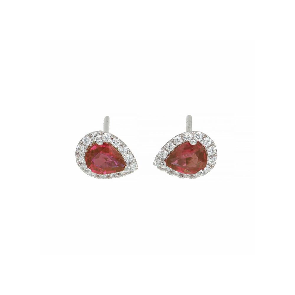 Ruby and diamond earrings. 2 well cut pear shaped rich red rubies mounted in 14k white gold settings. Each ruby has a halo of 14 round brilliant cut diamonds. Designed and crafted in the Peter Suchy Workshop.

2 pear shaped red rubies, approx.