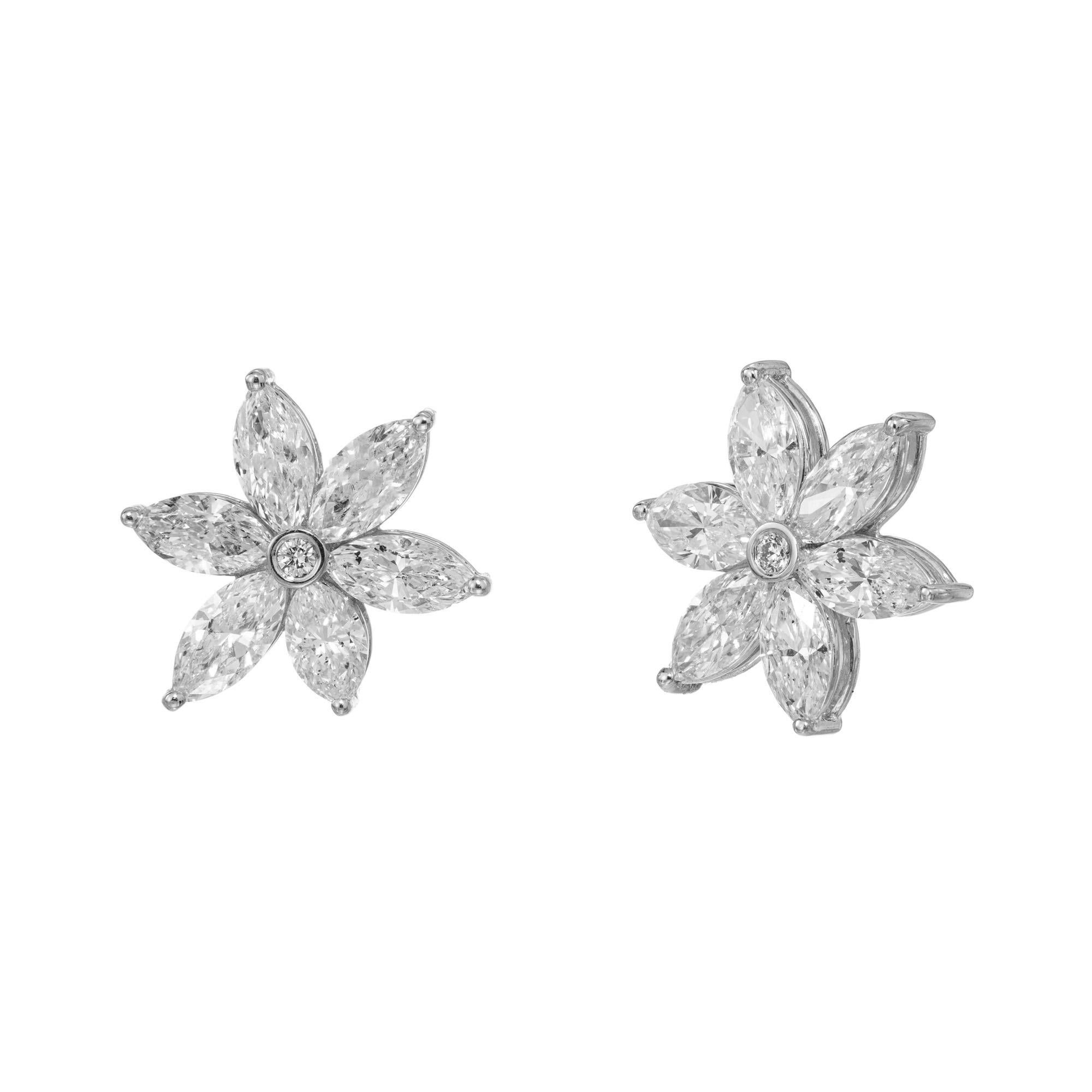 Peter Suchy Jewelers 6.41ct Marquise Diamond Platinum earrings. At the center of these stunning earrings are 2 round bezel set diamonds each accented by 6 marquise diamonds. The 12 marquise have a total carat weight of 6.41cts. Bright and sparkly