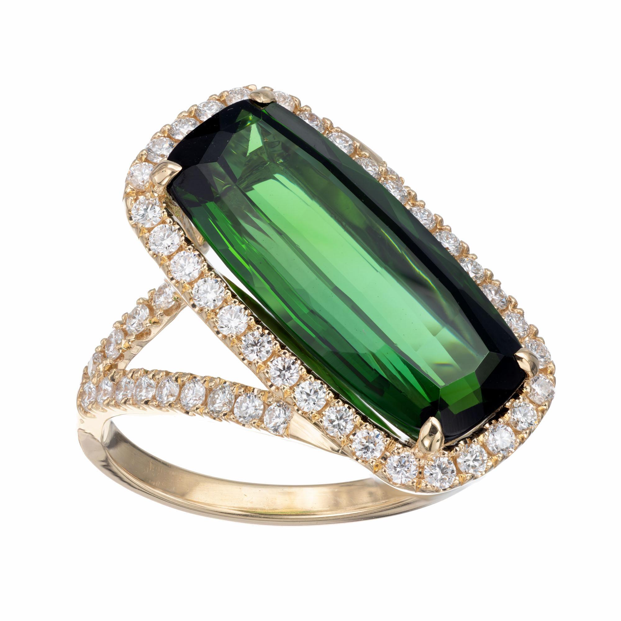 Green cushion shape tourmaline and diamond cocktail ring. 6.43 tourmaline center stone with a halo of round pave set diamonds in an 18k yellow gold swirl design setting. Crafted in the Peter Suchy workshop 

1 cushion rectangular green tourmaline