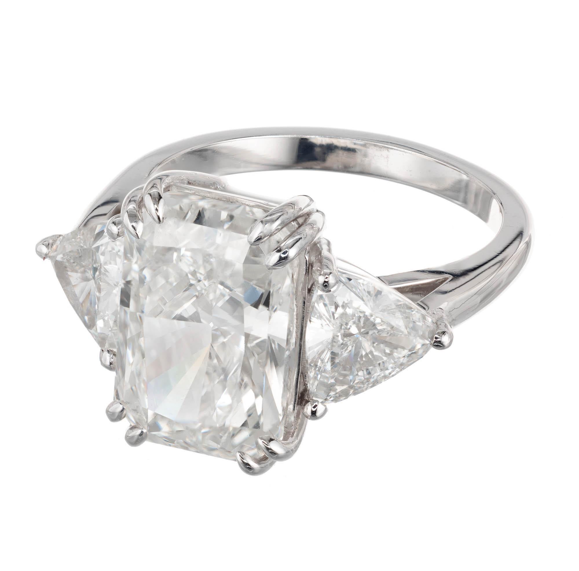 Peter Suchy three-stone diamond engagement ring. 4.99 carat rectangular radiant cut diamond with two well matched with trilliant cut diamonds. The platinum setting was designed and crafted in the Peter Suchy Workshop. 

1 rectangular brilliant cut J