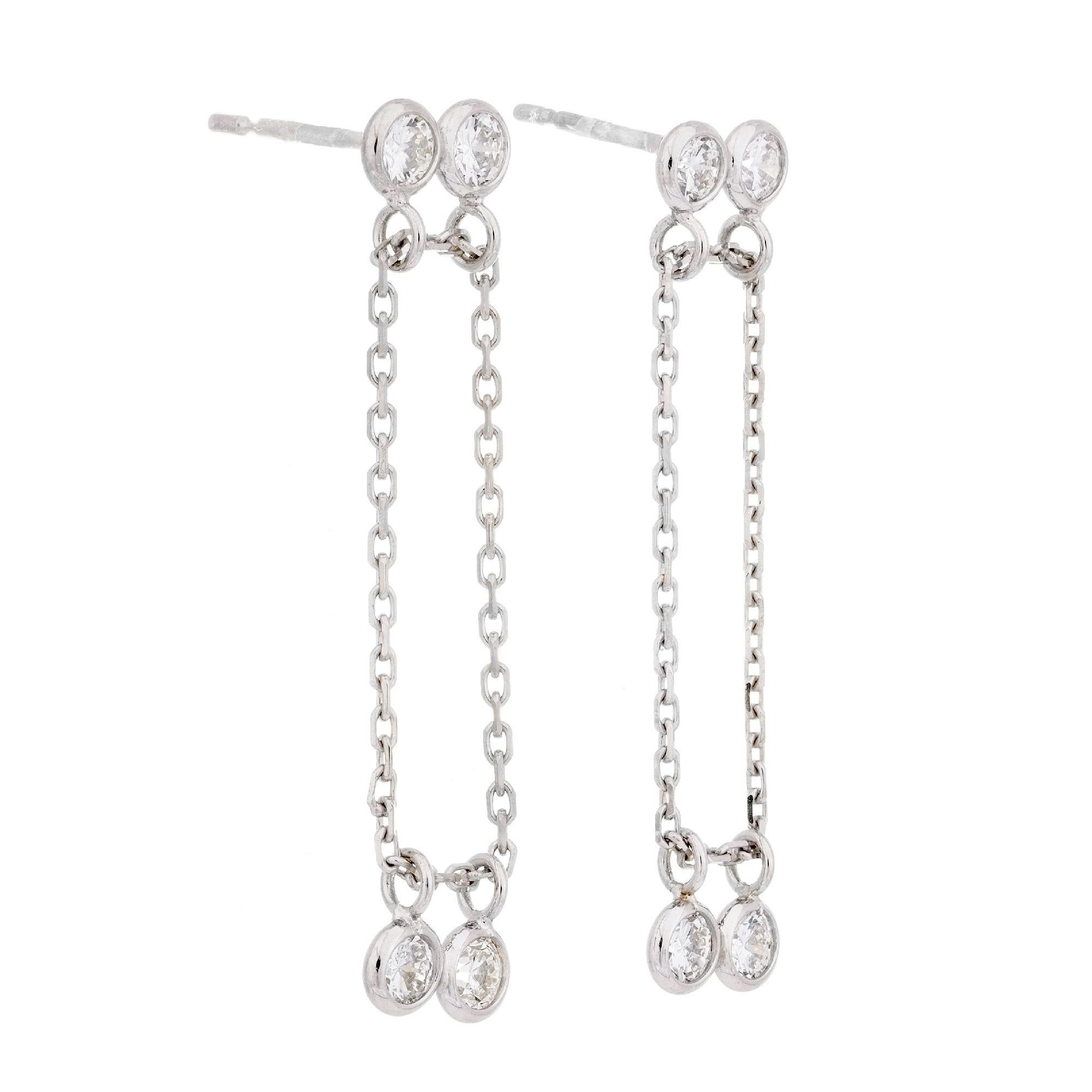 Peter Suchy infinity design diamond dangle drop earrings. 2 diamonds float on a chain that moves freely through the jump rings and two diamonds are stable at top. 

8 round full cut diamonds, approx. total weight .65cts, H, VS1 - VS1
14k white