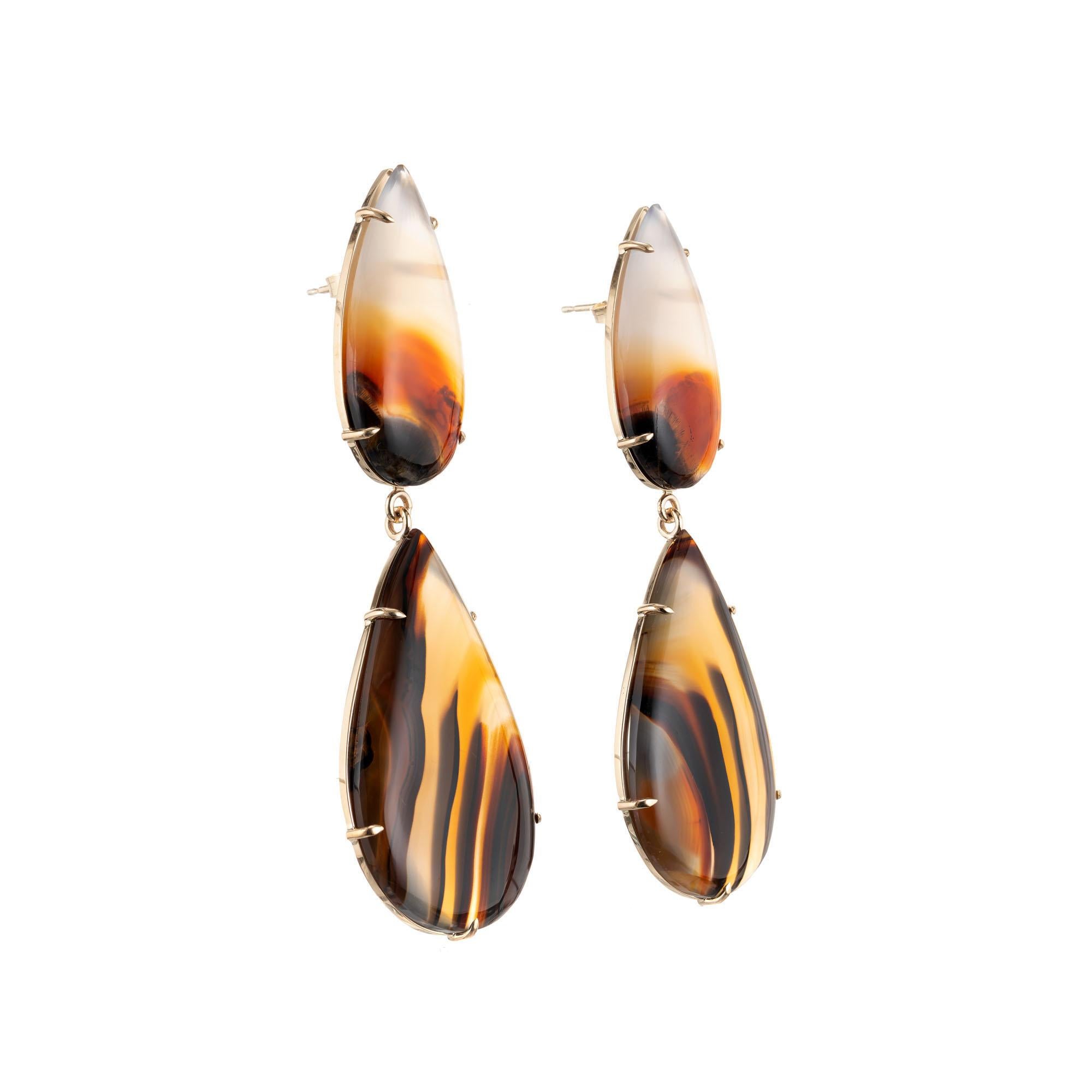 Peter Suchy banded Agate dangle earrings set in 14k yellow gold setting. Natural stones. Handmade in the Peter Suchy Workshop.

2 pear shape cabochon Agate, approx. total weight 43.26cts 
2 pear shape cabochon Agate, approx. total weight 22.46cts