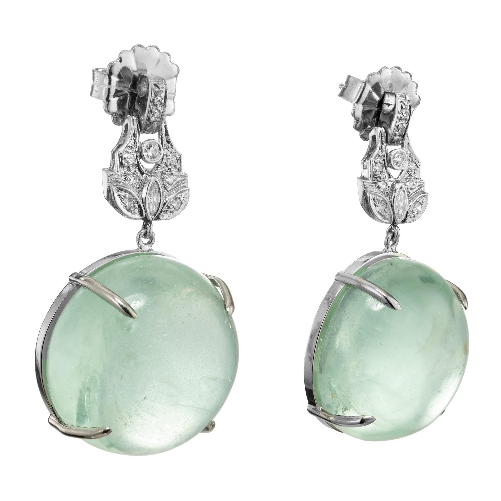 Peter Suchy Aqua and diamond Platinum dangle earrings. 2 round stunning cabochon aquamarines with a total weight of 74.23cts. Mounted in Platinum settings. The aquas have unusual rainbow inclusions and are accented with marquise and single cut