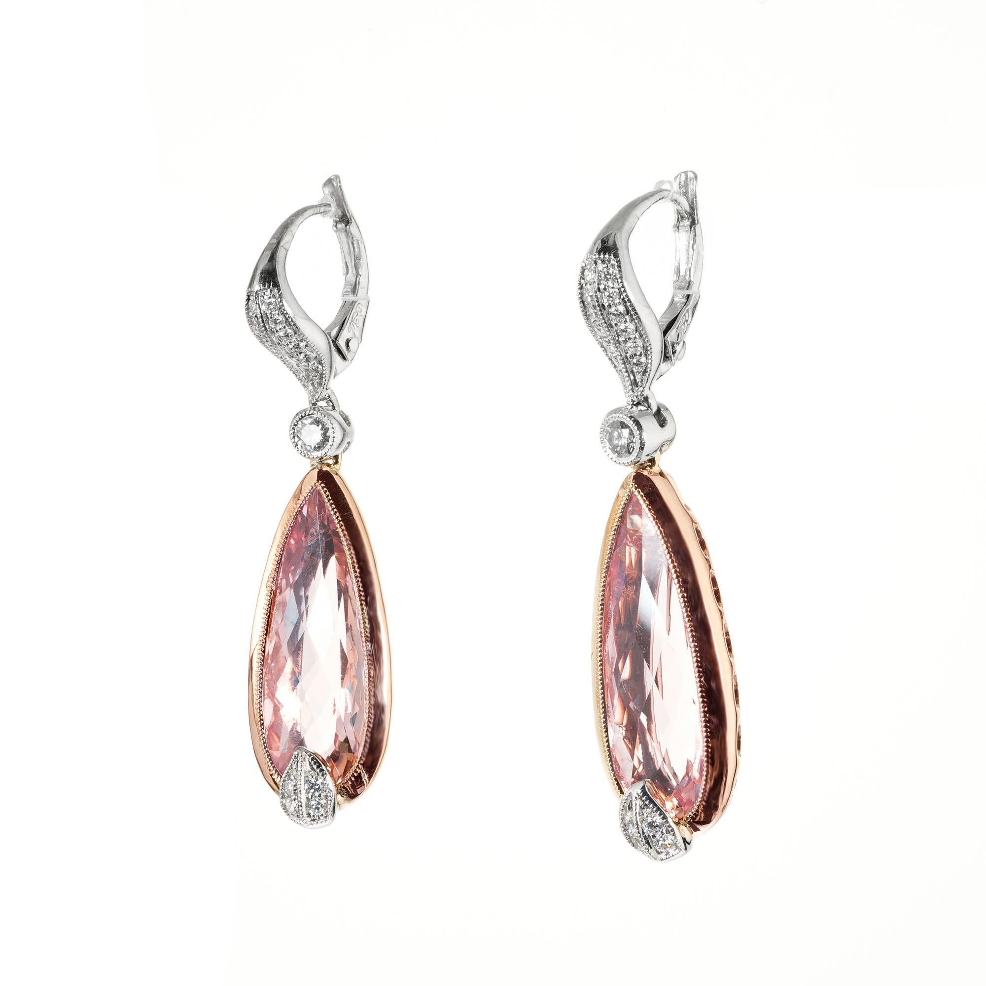 Morganite and diamond dangle earrings. 2 pear shaped morganites set in 18k rose gold bezels accented with 34 round brilliant cut diamonds set in 18k white gold. Designed and crafted in the Peter Suchy workshop.

2 pear shaped pink morganite, approx.