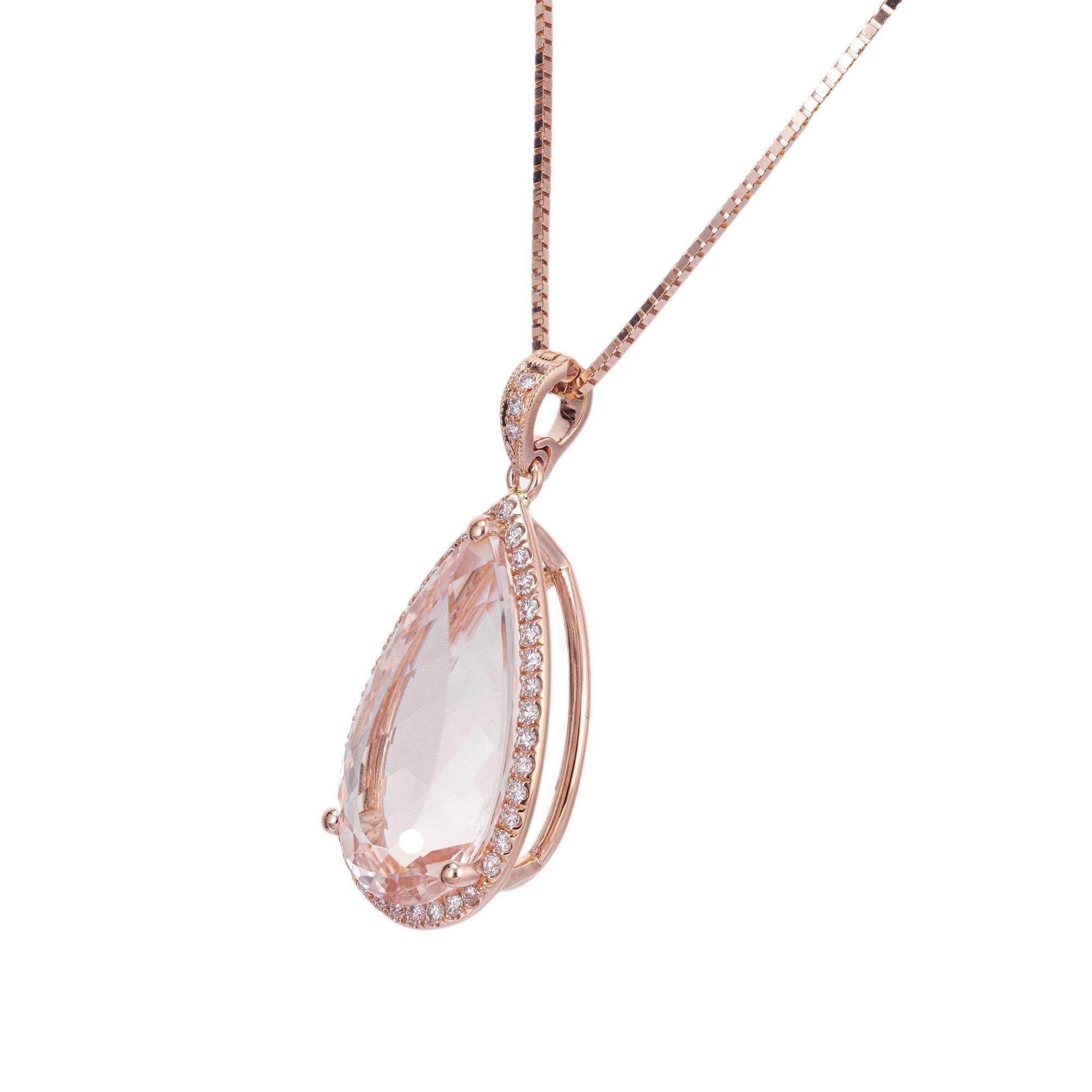 Soft pink 8.56 carat morganite and diamond pendant necklace. Pear shaped morganite with a halo of 41 round brilliant cut diamonds. 14k rose gold setting and 16 inch chain. Designed and crafted in the Peter Suchy workshop

1 pear shaped pink