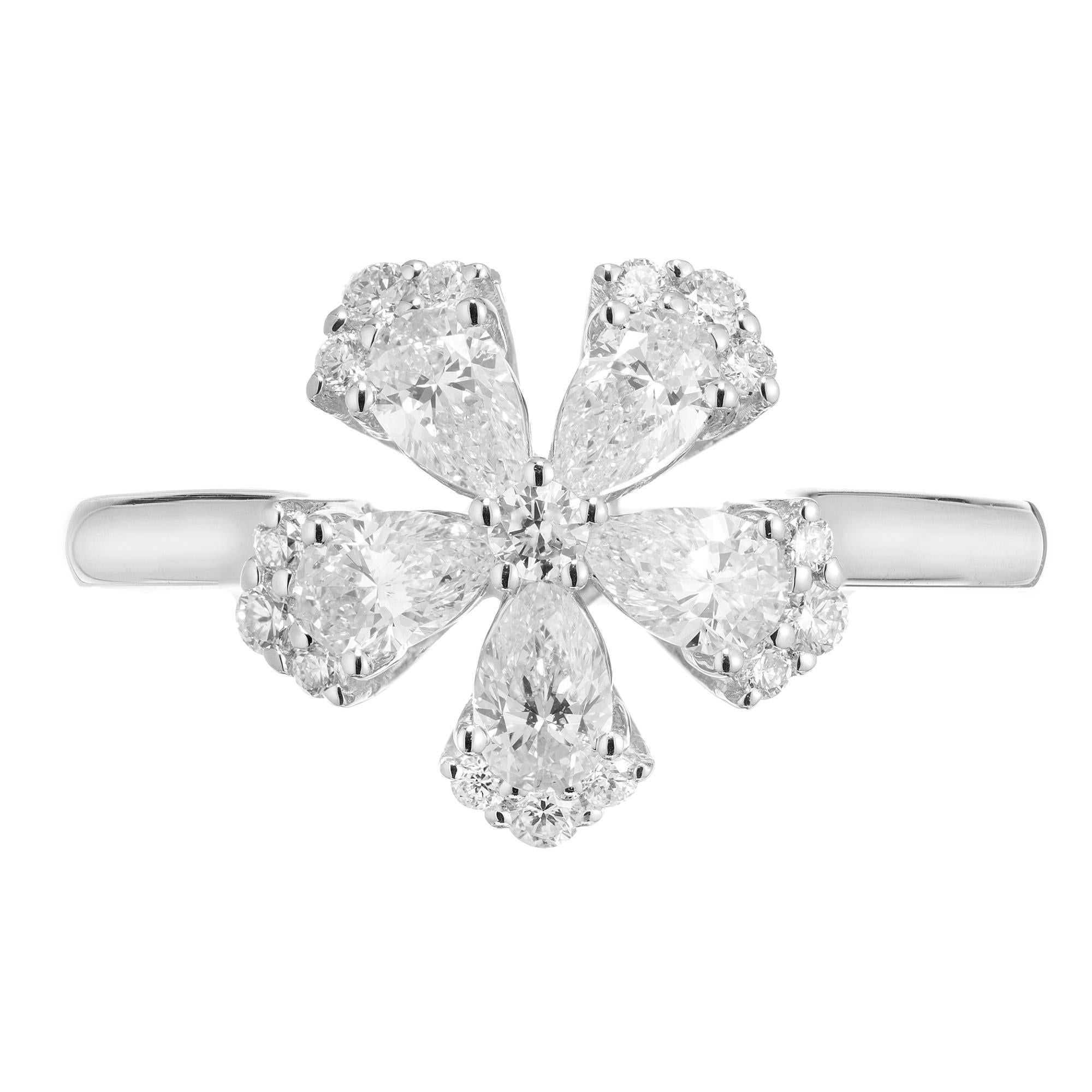 Beautiful brilliant, five pointed flower diamond ring. This unique creation consists 5 pear shaped diamonds totaling .73cts. Each diamond has a semi halo of three round brilliant cut diamonds. One round brilliant cut diamond sits in the middle of
