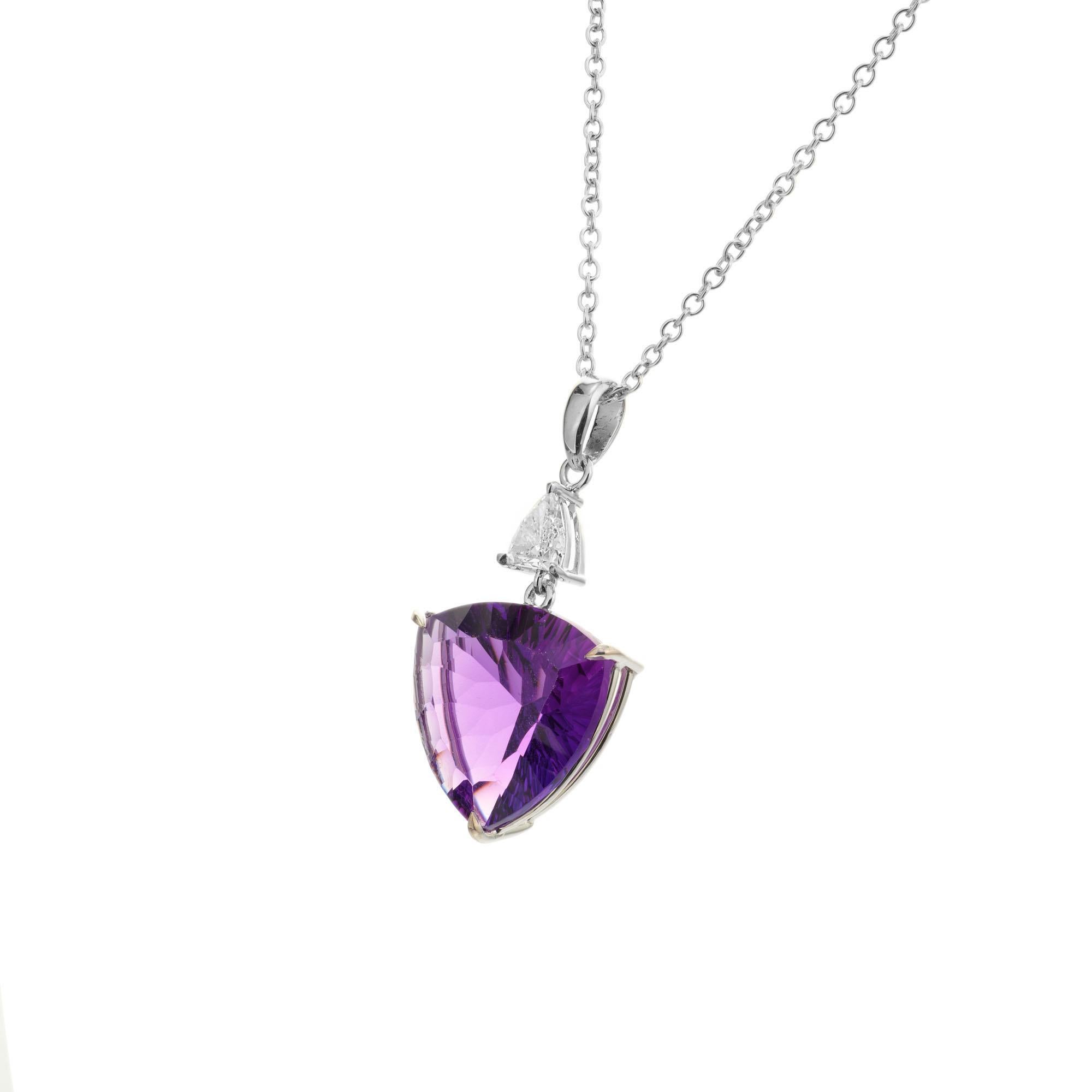 Amethyst and diamond pendant necklace. 9.25ct Triangle shaped cushion cut amethyst accented with a trilliant cut diamond set in 14k white gold pendant. 18 inch 14k white gold chain. Designed and crafted in the Peter Suchy workshop.

1 triangular