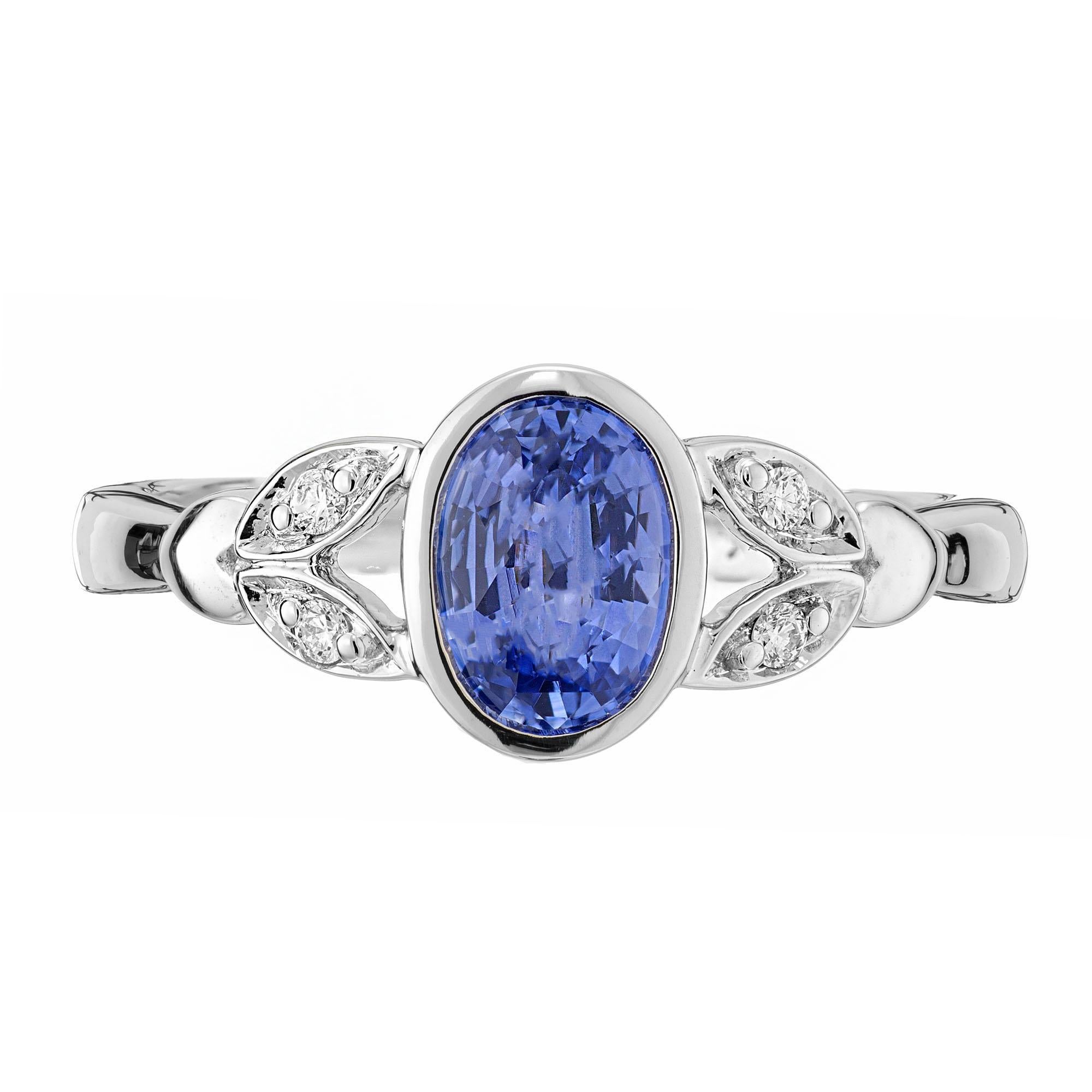 Natural oval blue sapphire and diamond engagement ring. Simple heat only, bezel set sapphire, with 4 round brilliant cut side diamonds. Designed and crafted in the Peter Suchy workshop.

1 oval blue sapphire, VS-SI approx. .93cts
4 round brilliant