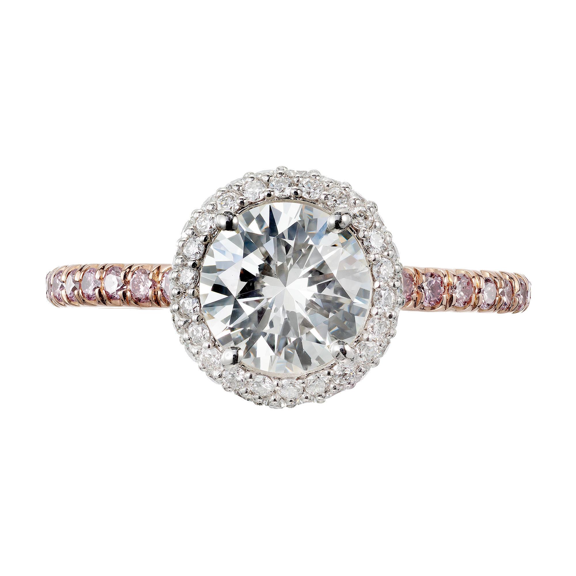 EGL certified diamond engagement ring.  .96cts center stone with a halo of white diamonds in a 18k rose gold setting with pink accent diamonds. Created in the Peter Suchy Workshop. 

1 round brilliant cut diamond J VS2, approx. .96ct EGL Certificate
