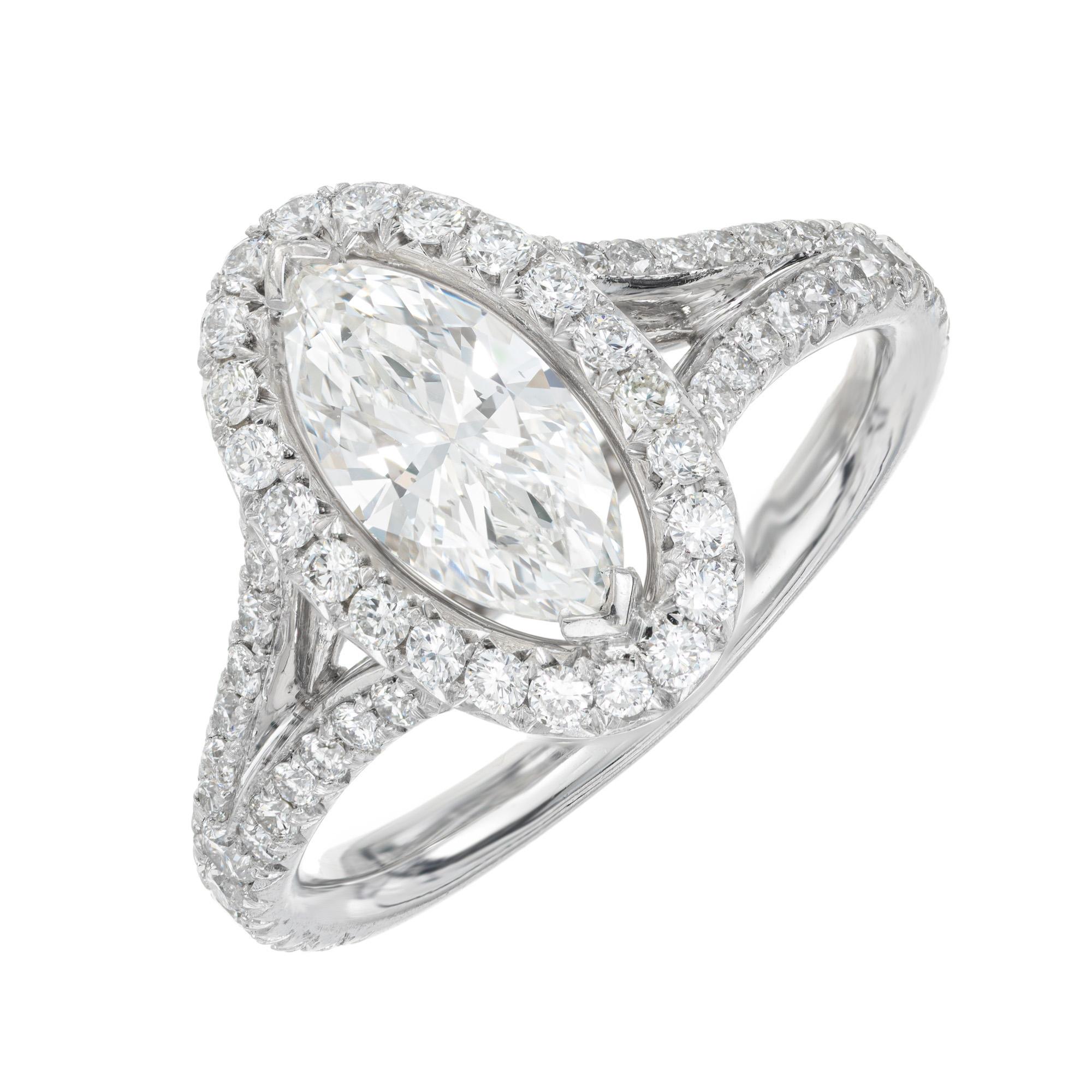 The Peter Suchy .99ct marquise diamond halo platinum engagement ring is a masterpiece that elegantly marries timeless beauty with modern sophistication. This ring features a stunning .99 carat marquise diamond, meticulously set to capture and