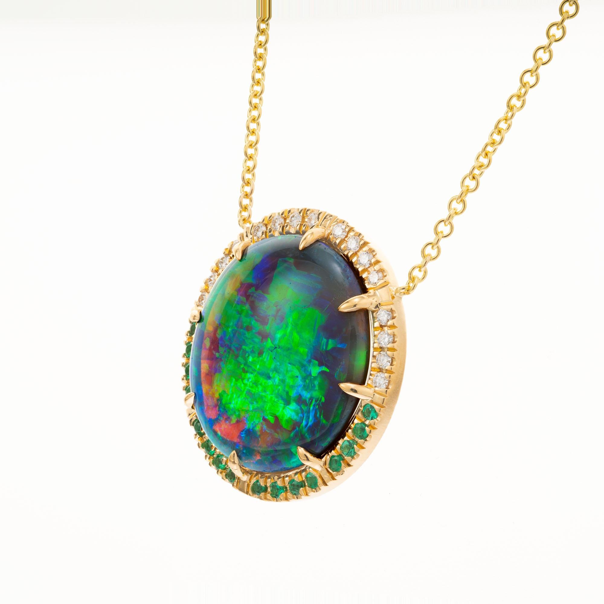 Opal and diamond pendant necklace. AGL certified natural 13.62cts. with a halo ofr white and green round diamonds. Opal has a broad flash pattern of yellow, green and blue. Natural and no enhancements.  20 inch yellow gold chain. Crafted in the