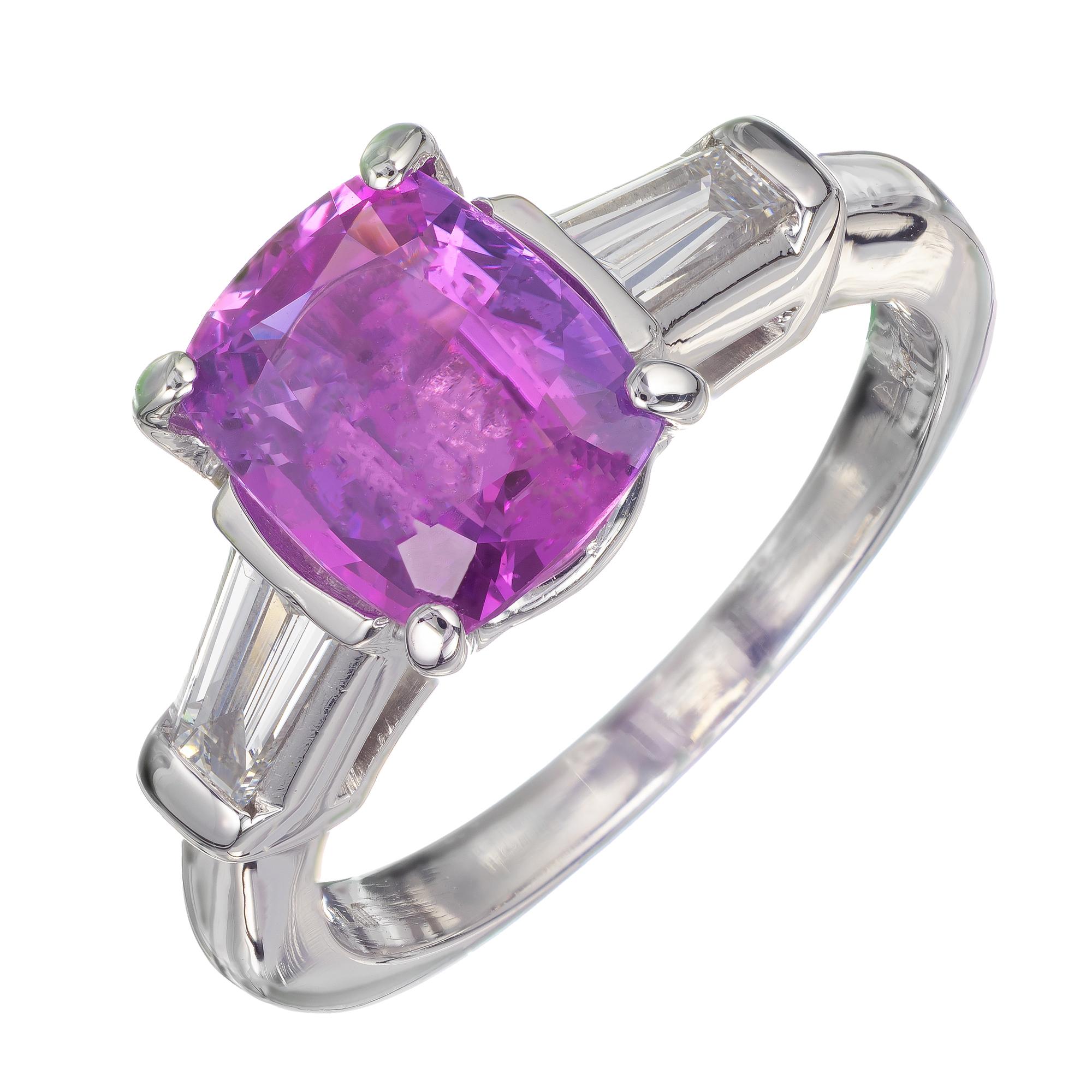 Pink purple sapphire and diamond three-stone engagement ring. AGL certified natural no heat estate cushion pink purple 2.67 carat center sapphire set into a custom-made platinum classic three-stone ring with accent baguette diamonds.

1 cushion