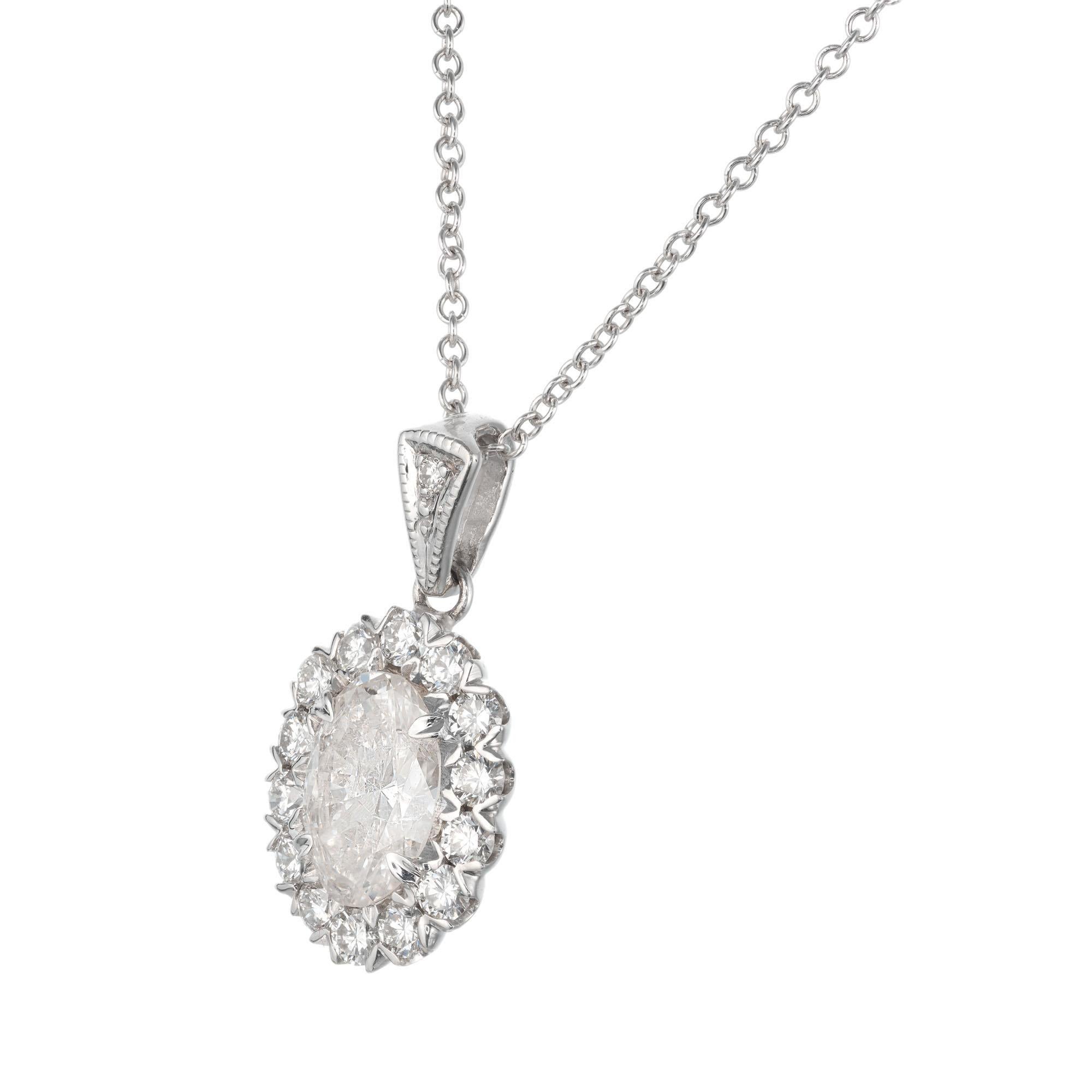 Oval diamond pendant necklace. EGL center stone with a halo of 15 round diamonds in 18k white gold, on a 18 inch white gold chain. Created in the Peter Suchy Warehouse. 

1 EGL certified oval diamond approx. total weight .77cts, G-H, I1, 7.60 x 5.30