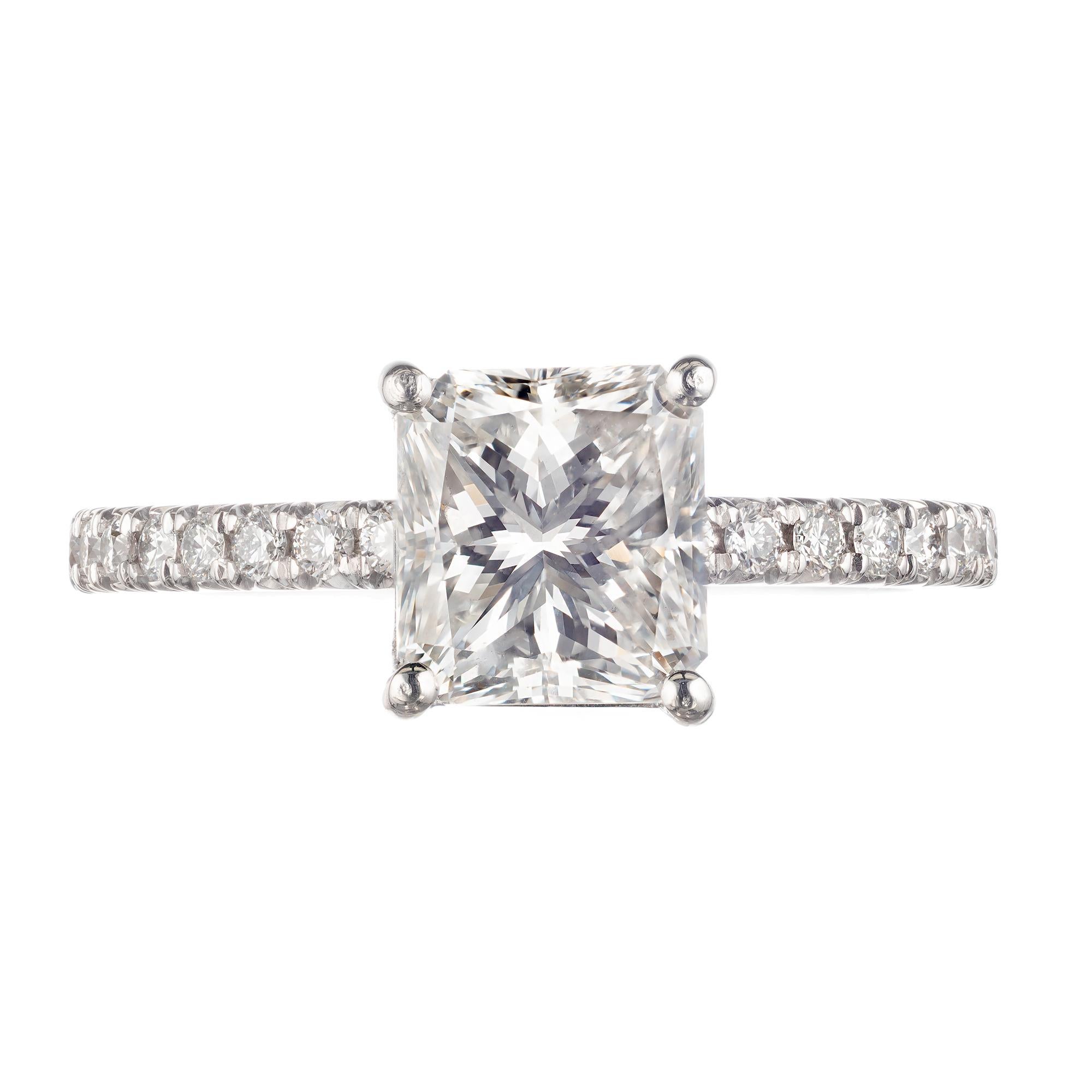Diamond engagement ring. EGL certified 1.61ct center stone set in a custom made platinum setting with twenty round brilliant cut accent diamonds, from the Peter Suchy Workshop. Designed so that a wedding band can sit flush against the setting. 

1