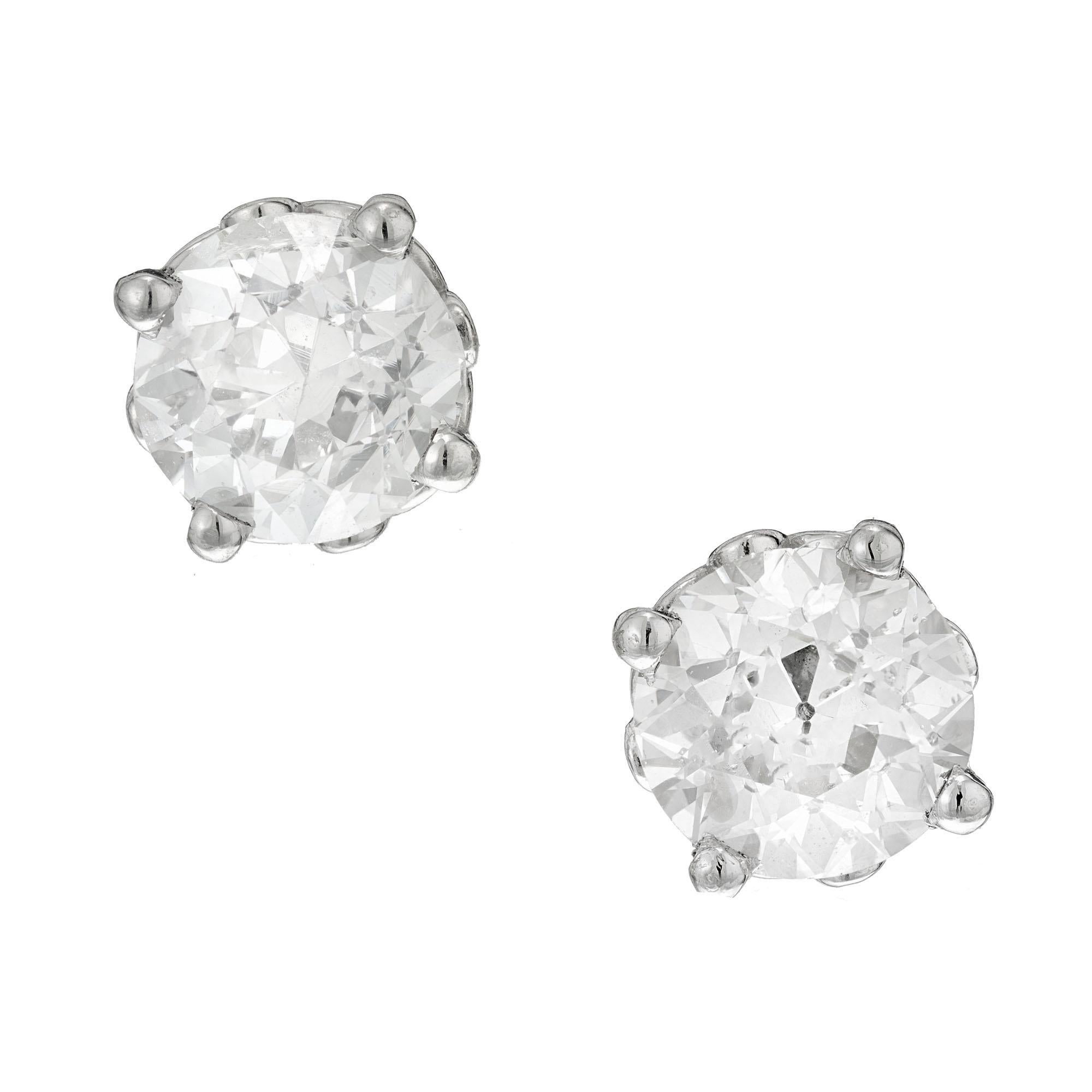 2 Old European cut diamonds set in four prong scroll design platinum stud earrings. Deigned and crafted in the Peter Suchy workshop

1 Old European cut diamond, J-K I approx. .82cts EGL Certificate # US400119278D
1 Old European cut diamond, M-N SI3