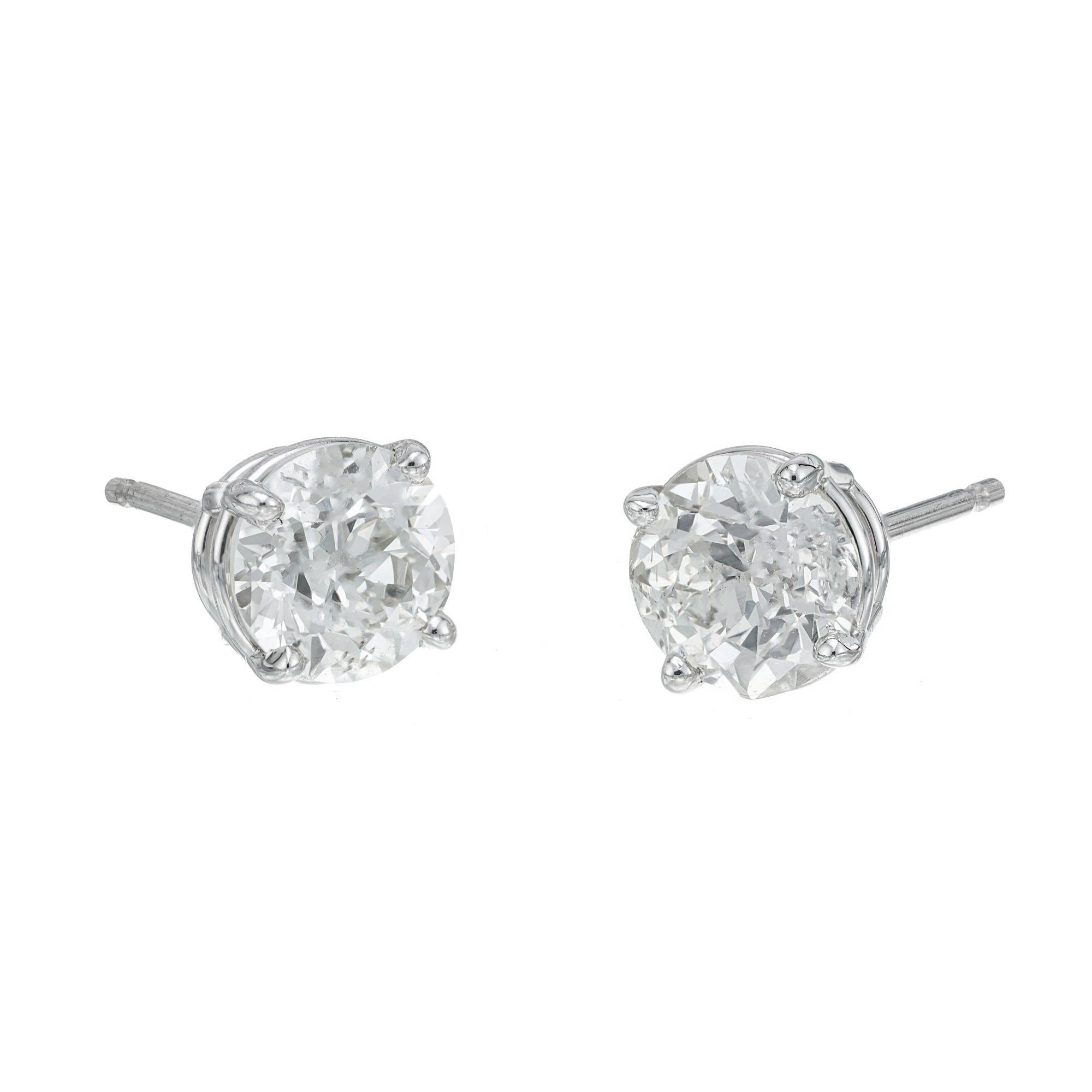 EGL certified Old European cut diamonds circa 1900 in new platinum basket earring settings. Designed and crafted in the Peter Suchy Workshop

1 Old European cut diamonds, J-K I approx. .95cts EGL Certificate # 400148924D
1 Old European cut diamond,