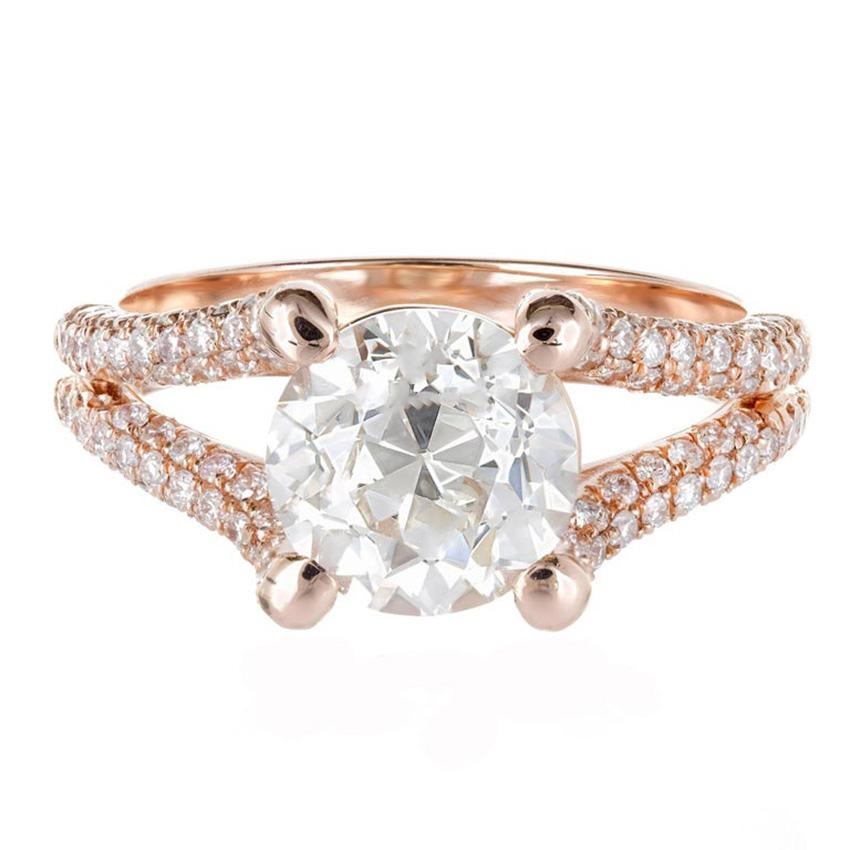 Diamond engagement ring. This EGL certified transitional cut center diamond sits in a 18k rose gold split shank setting with 16 near colorless ideal cut, micro pave accent diamonds in multi-rows along the shank. The 2.32ct transitional round