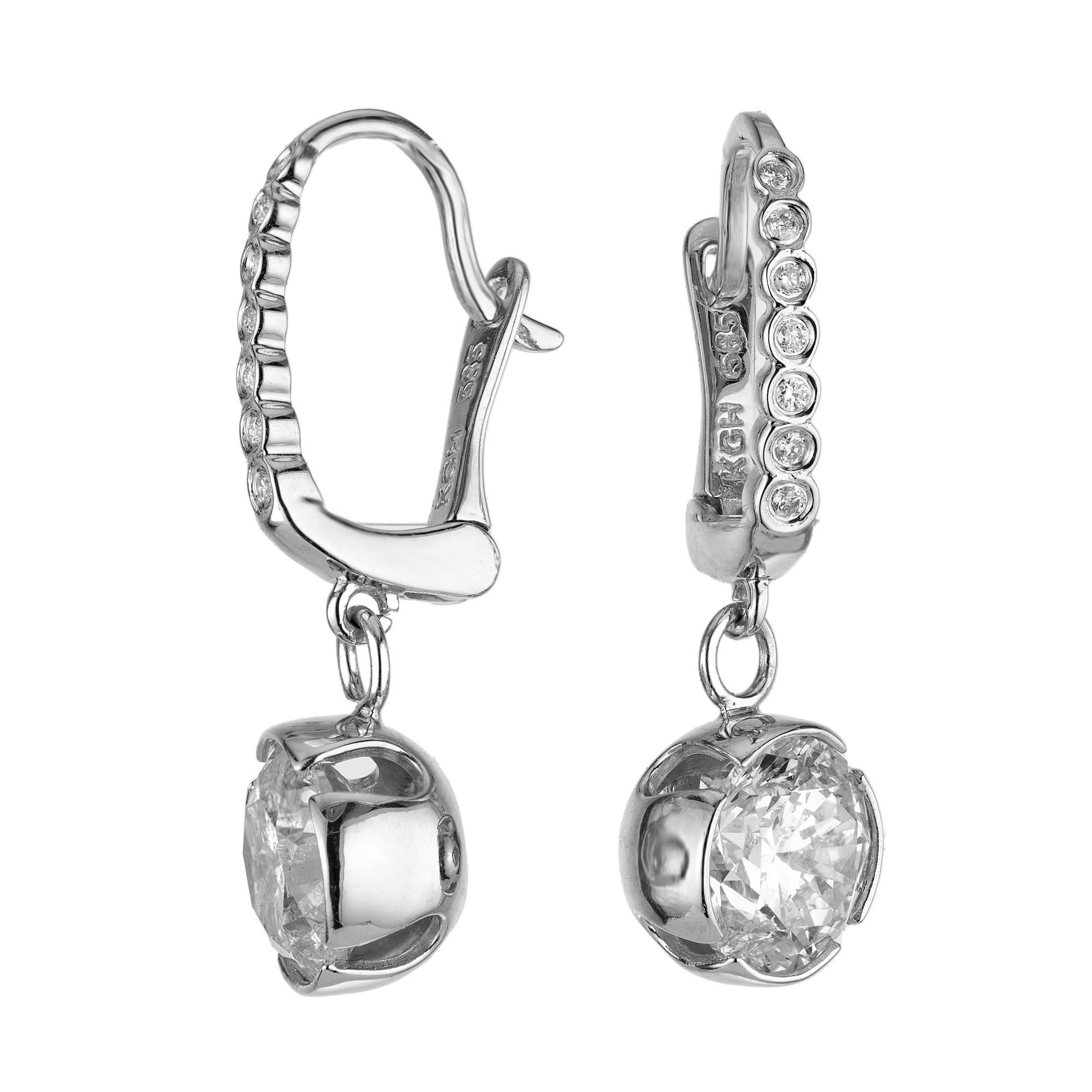 Bright and sparkly diamond dangle earrings that consist of 1.60ct and 1.50ct round brilliant cut diamonds. Simple secure lever back tops crafted in 14k white gold. Each upper dangle consists of 7 graduated round brilliant cut, bezel set diamonds.