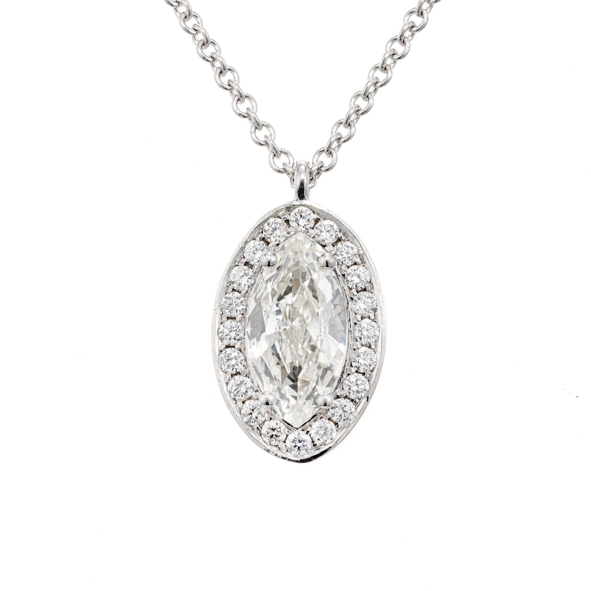 Diamond halo pendant necklace. EGL certified .66 marquise cut center diamond. Mounted in a custom made bezel setting accented with a halo of 20 full cut diamonds. The EGL certified this stone as K-L, slight yellow tone. A 15.25 inch diamond by the