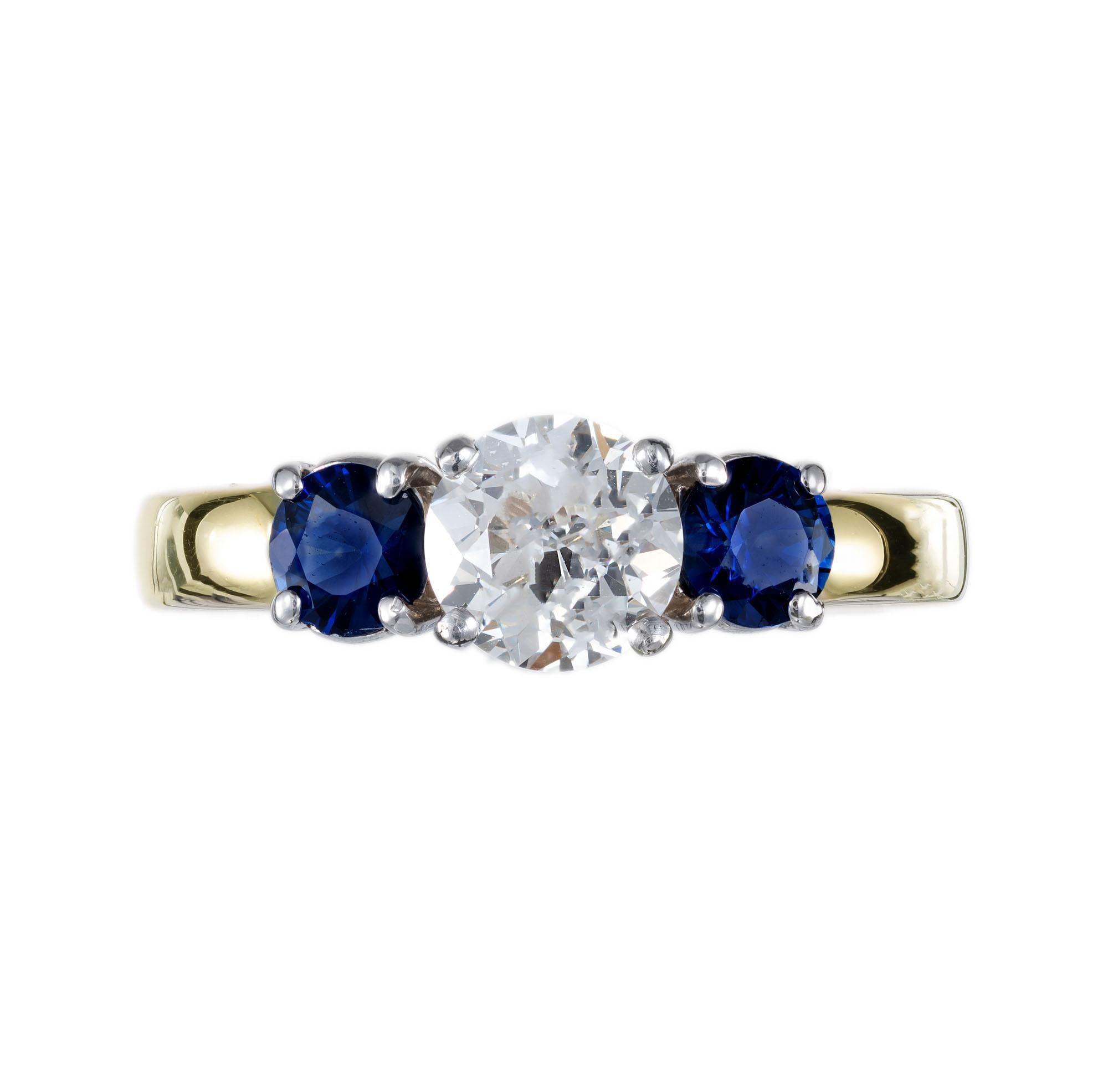 Diamond and sapphire engagement ring. EGL certified old European center diamond with two GIA certified side round sapphires, set in a 18k yellow gold setting with a platinum triple crown. The ring was created in the Peter Suchy workshop.

1 Old
