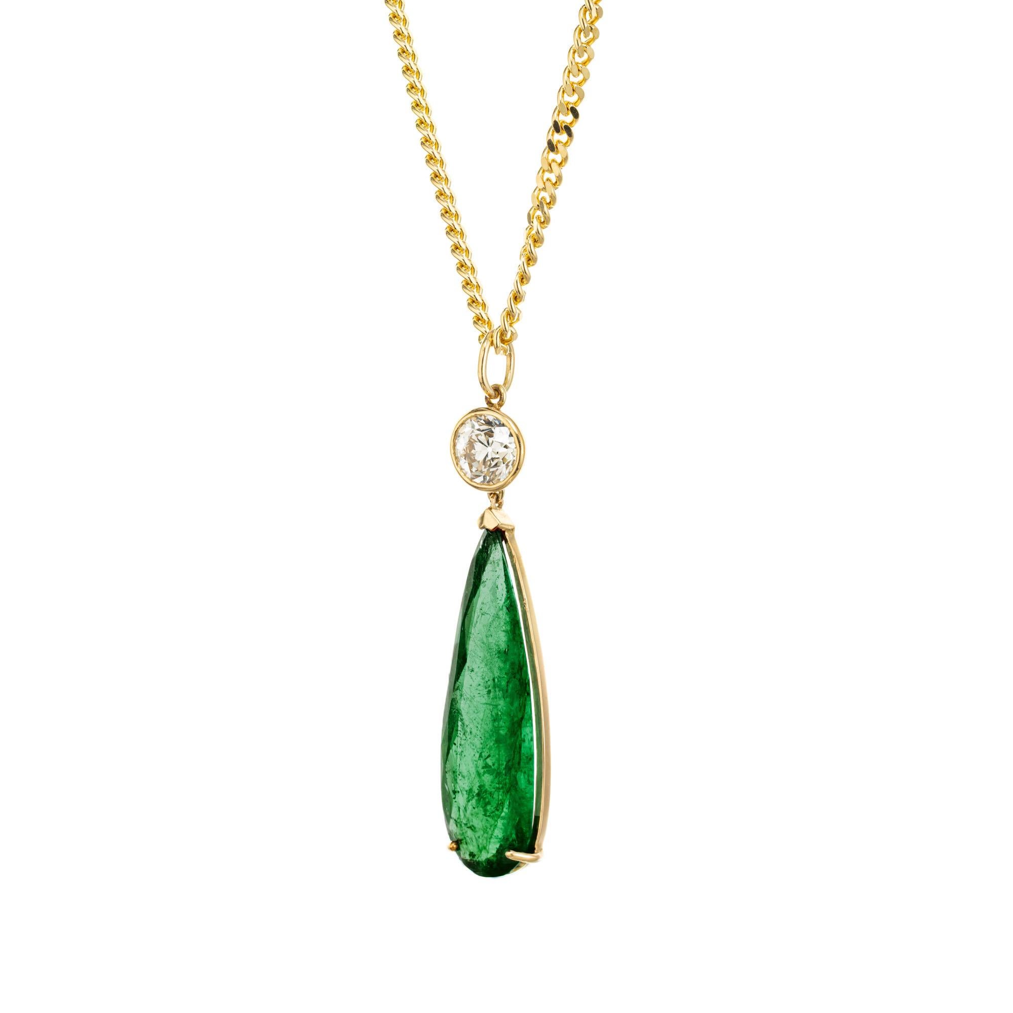 Emerald and diamond pendant necklace. GIA certified 10.09ct natural Emerald moderate clarity enhancement only elongated pear shape in a handmade 18k yellow gold setting with a 1.11ct old European cut bezel set diamond.  circa 1920 - 1930. 20 inch