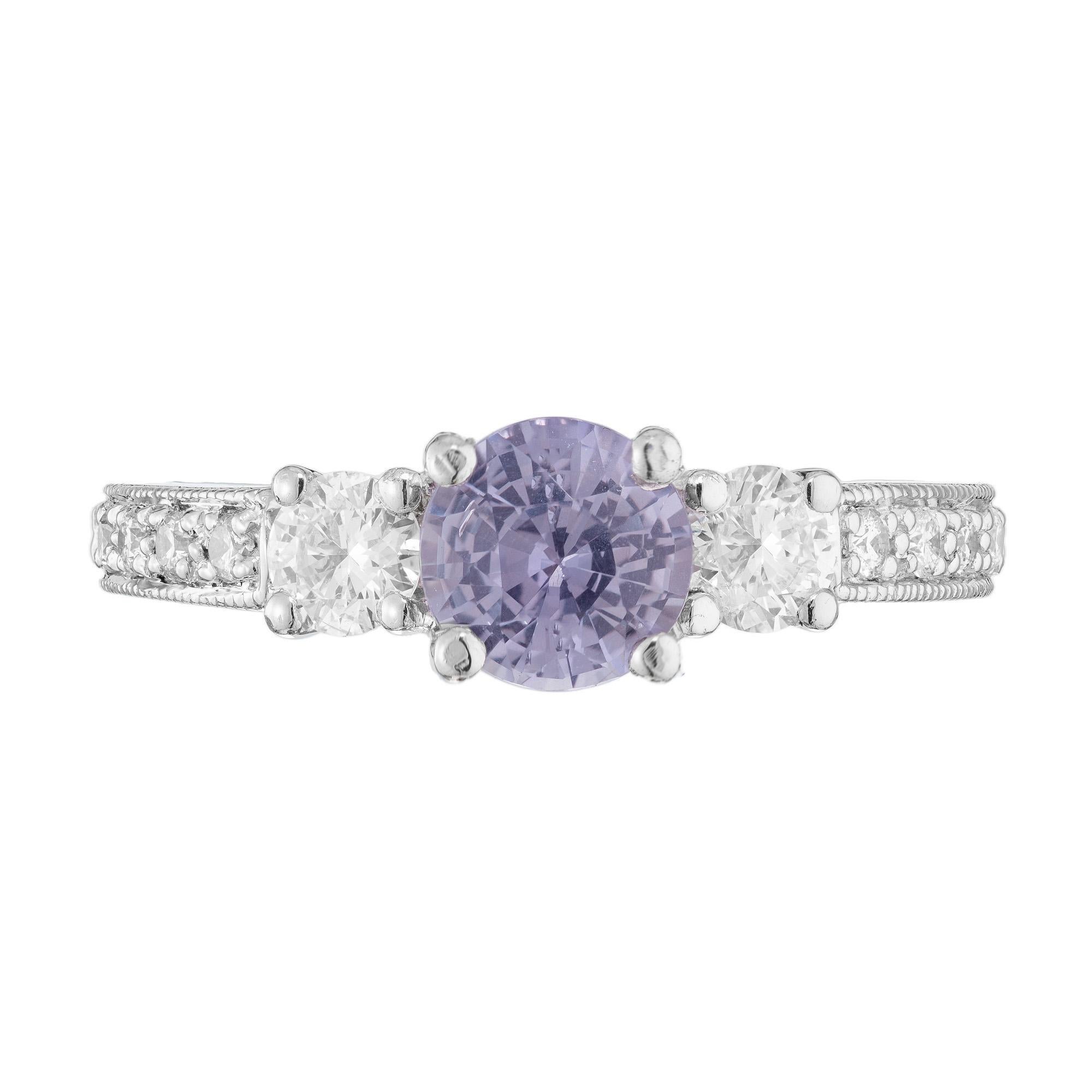 Created in the Peter Suchy Workshop, natural untreated round brilliant cut Sapphire and diamond engagement ring. This ring begins with a color change sapphire that changes from light grey blue to gray purple in daylight versus incandescent light.