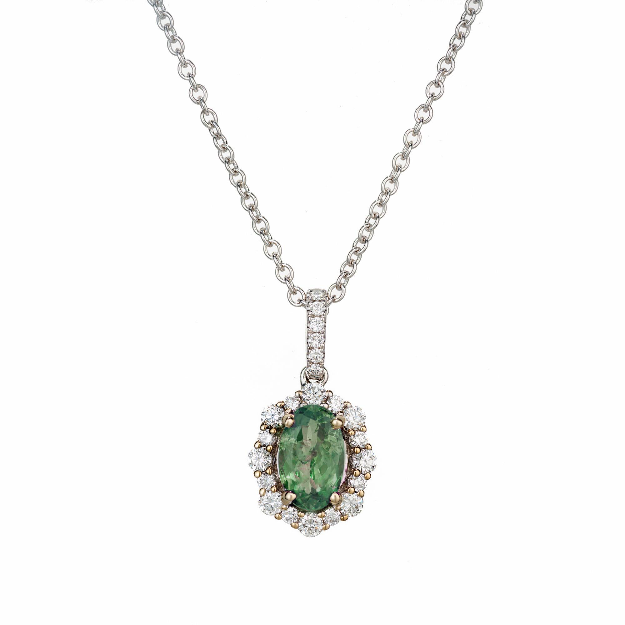 Green oval Alexandrite and diamond pendant necklace. Certified by the GIA as natural, no heat, oval shape, this 1.44ct Alexandrite is set in a 18k white gold setting with halo of round full cut white diamonds. The pendant is dangles from a 18 inch,