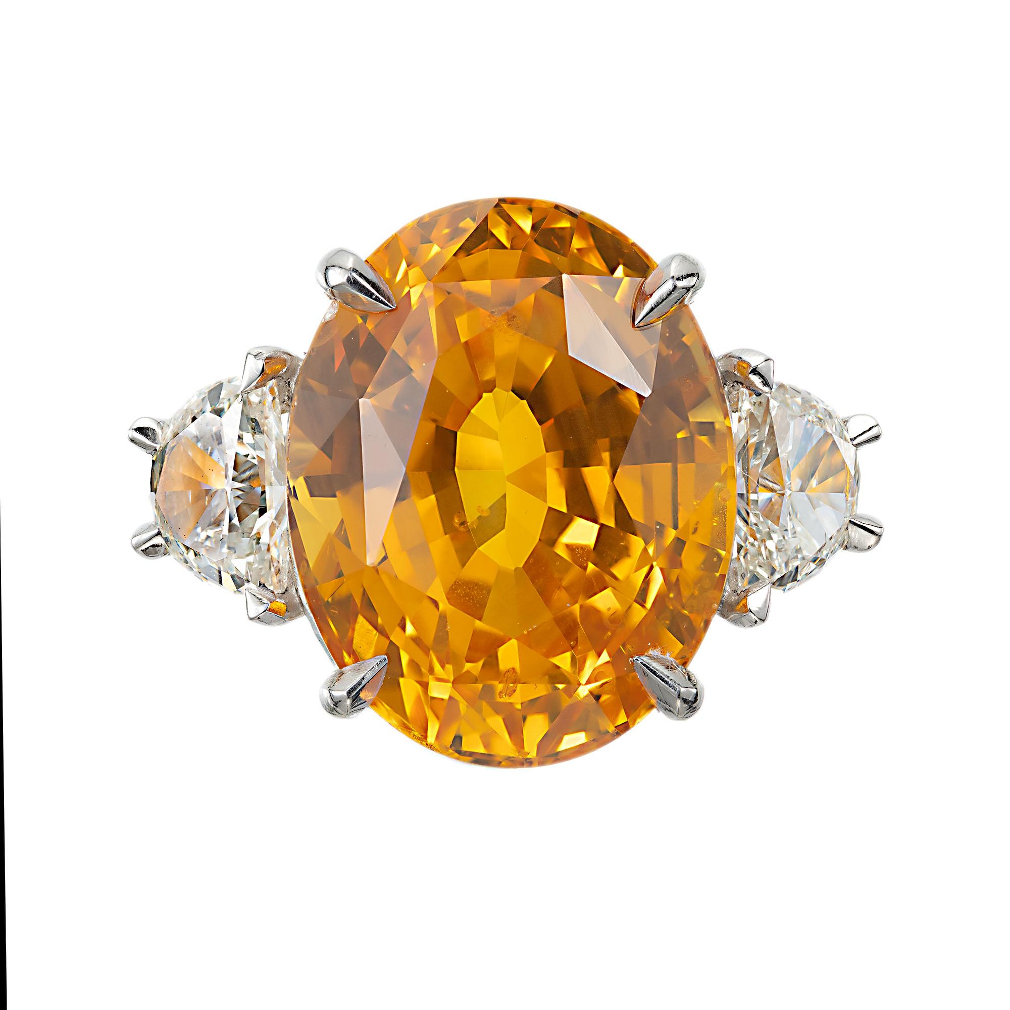 Orange and yellow oval sapphire and half moon diamond cocktail ring. GIA certified center oval center stone in a 18k yellow gold hand made setting with two half moon side diamonds. Crafted in the Peter Suchy Workshop. 

1 oval brilliant step cut