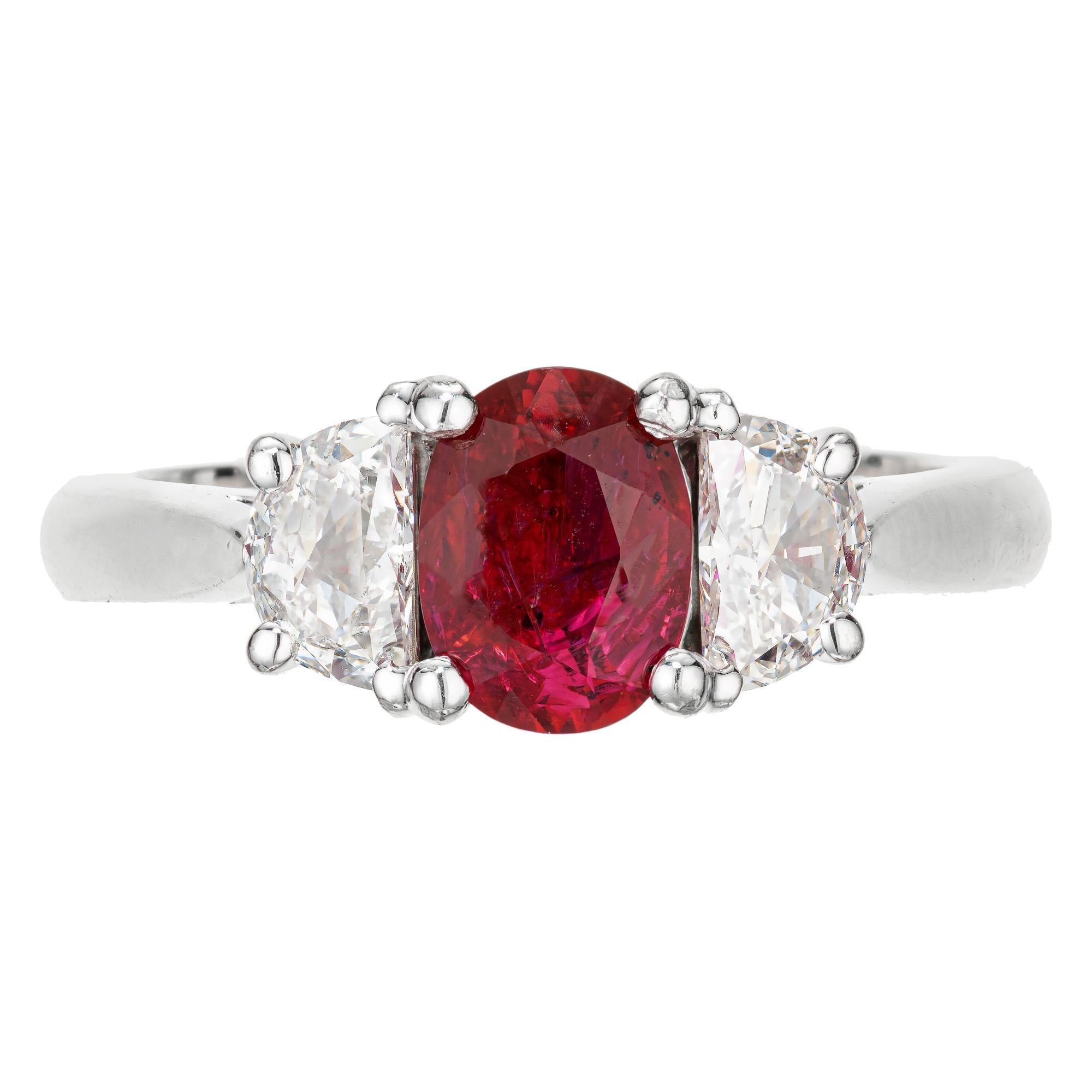Three stone platinum engagement ring. GIA certified 1.51cts Oval natural no heat ruby center stone in a handmade platinum basket setting with two half moon accent diamonds. Created in Peter Suchy Workshop.

1 oval red Ruby, approx. total weight