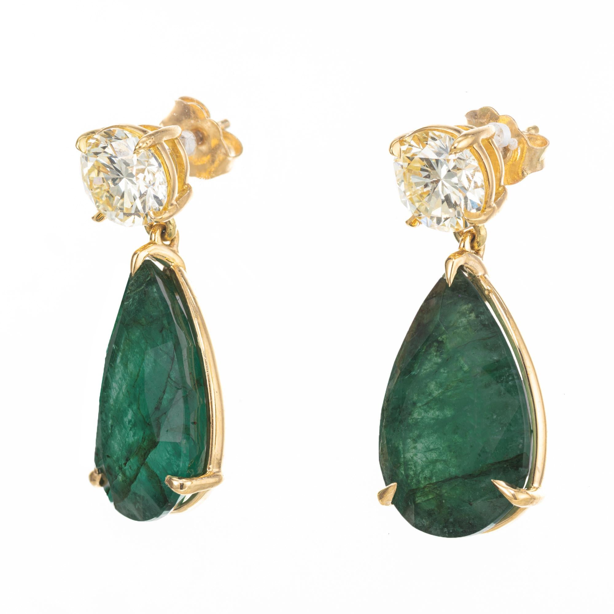Spectacular emerald and diamond dangle earrings. 2 GIA pear shaped emeralds one weighing 8.04 carats and other one at 7.51cts, set in 18k yellow gold three prong settings. Both gemstones have a rich green color, one stone has minor clarity