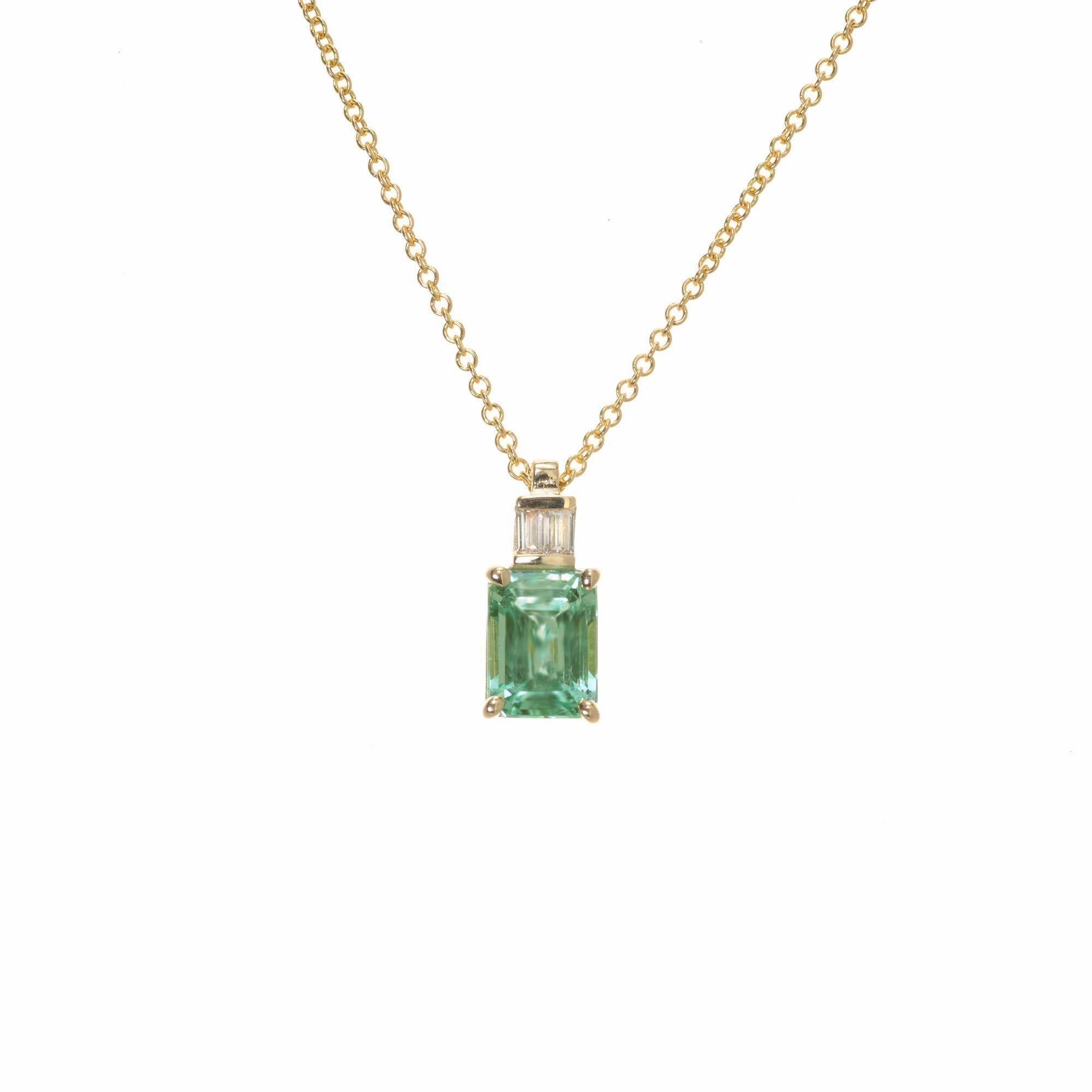 Natural bluish green 1.89 carat emerald and diamond pendant necklace. This rare GIA certified emerald is from a 1920's estate and placed into a 14k yellow gold setting with 2 straight baguette accent diamonds by the Peter Suchy Workshop. A 16 inch