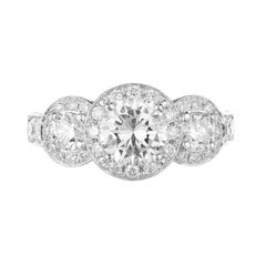 Peter Suchy Anillo de compromiso de platino con halo de diamantes de 1,96 quilates y tres piedras
