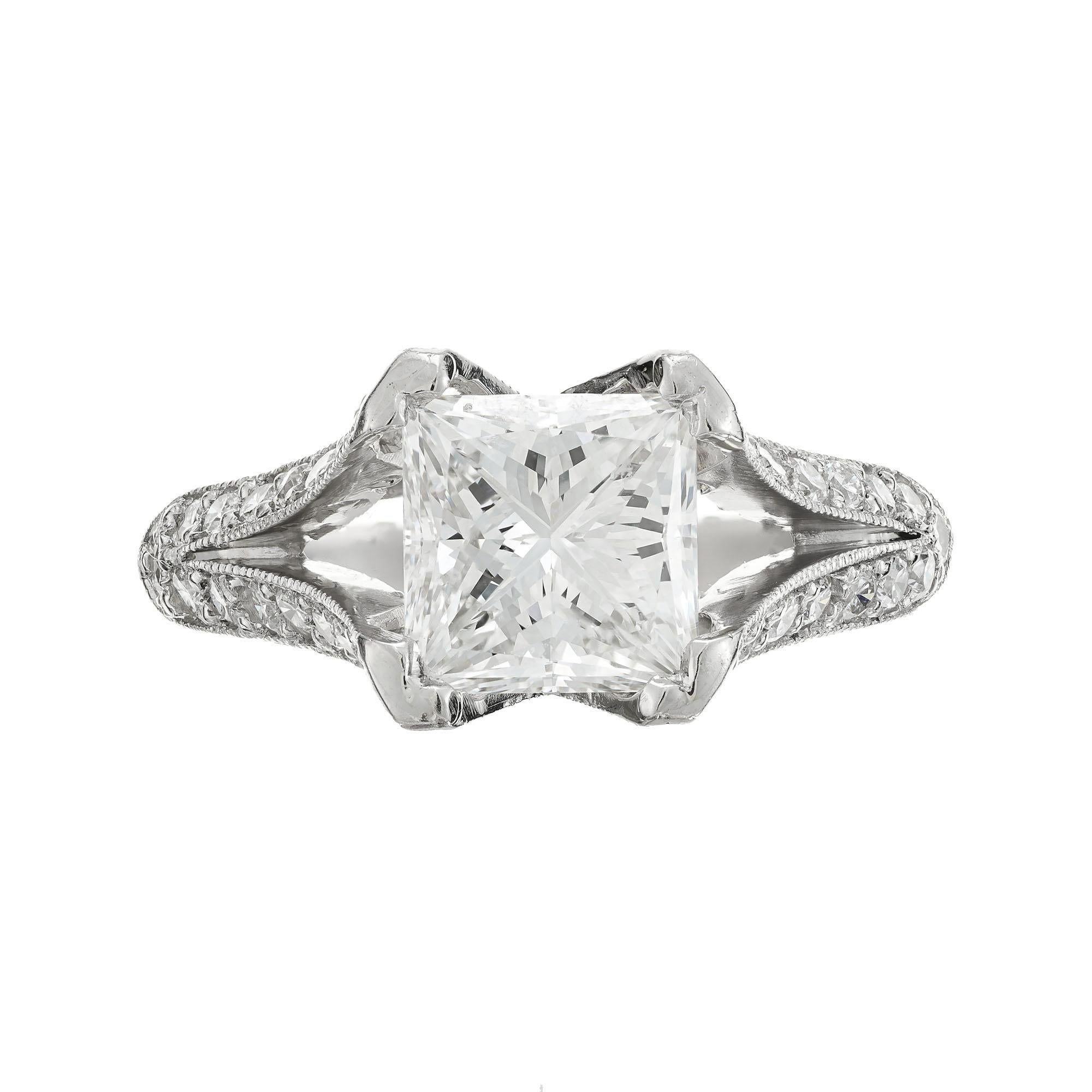 Diamond custom split shank engagement ring. Platinum shank with 44 round accent diamonds along the split shank. Suspension setting holds the diamond to show off its sparkle. The corners of the diamond are protected by the rounded edges.  GIA
