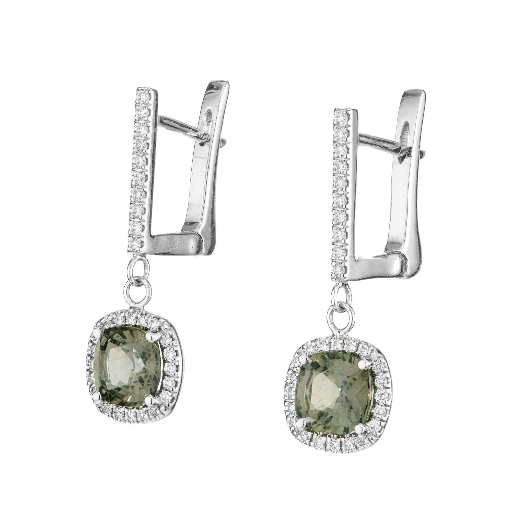 Step into elegance with these rare Peter Suchy sapphire and diamond dangle earrings. 2 cushion cut green and purple, bluish, green and purple sapphires. certified by the GIA as natural, no heat, and change color different lights. with a total carat