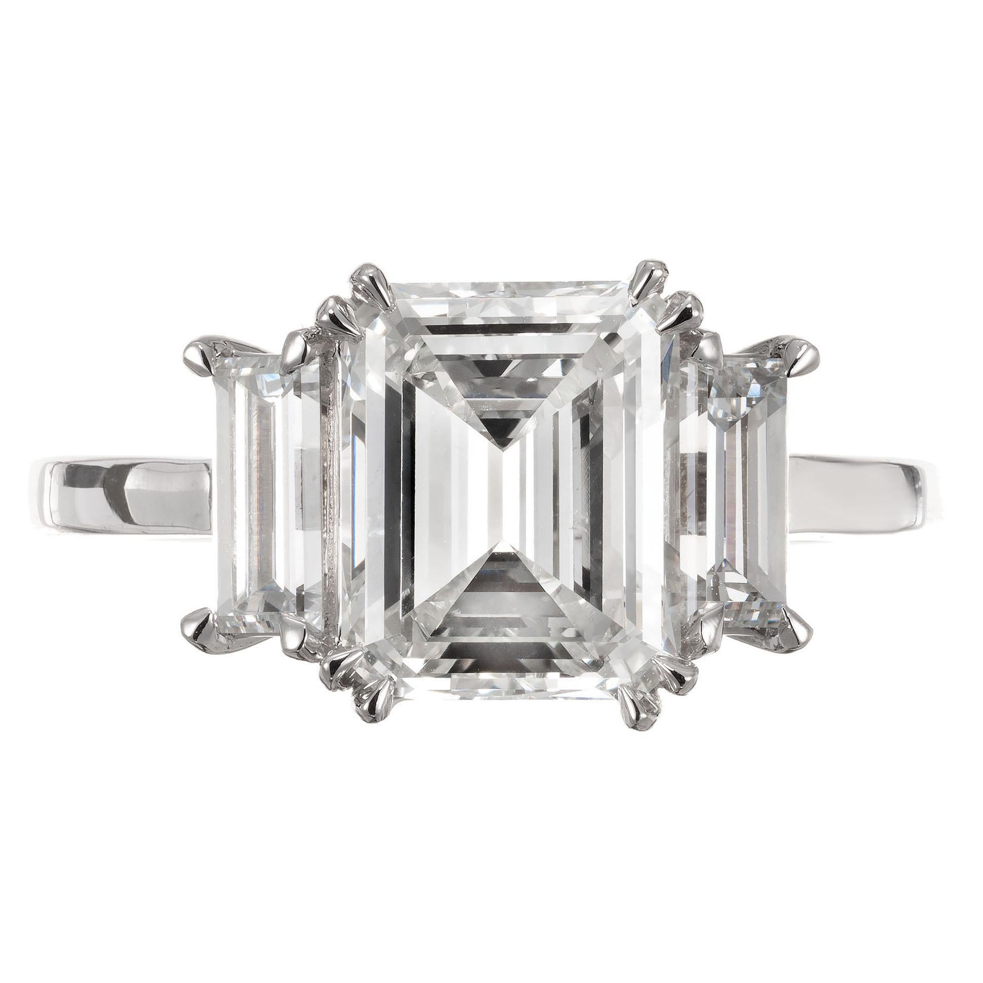 Peter Suchy Art Deco design handmade platinum diamond engagement ring. GIA certified emerald cut center stone with two 1920's straight baguette side diamonds in a handmade Art Deco inspired three-stone setting, created in the Peter Suchy Workshop.