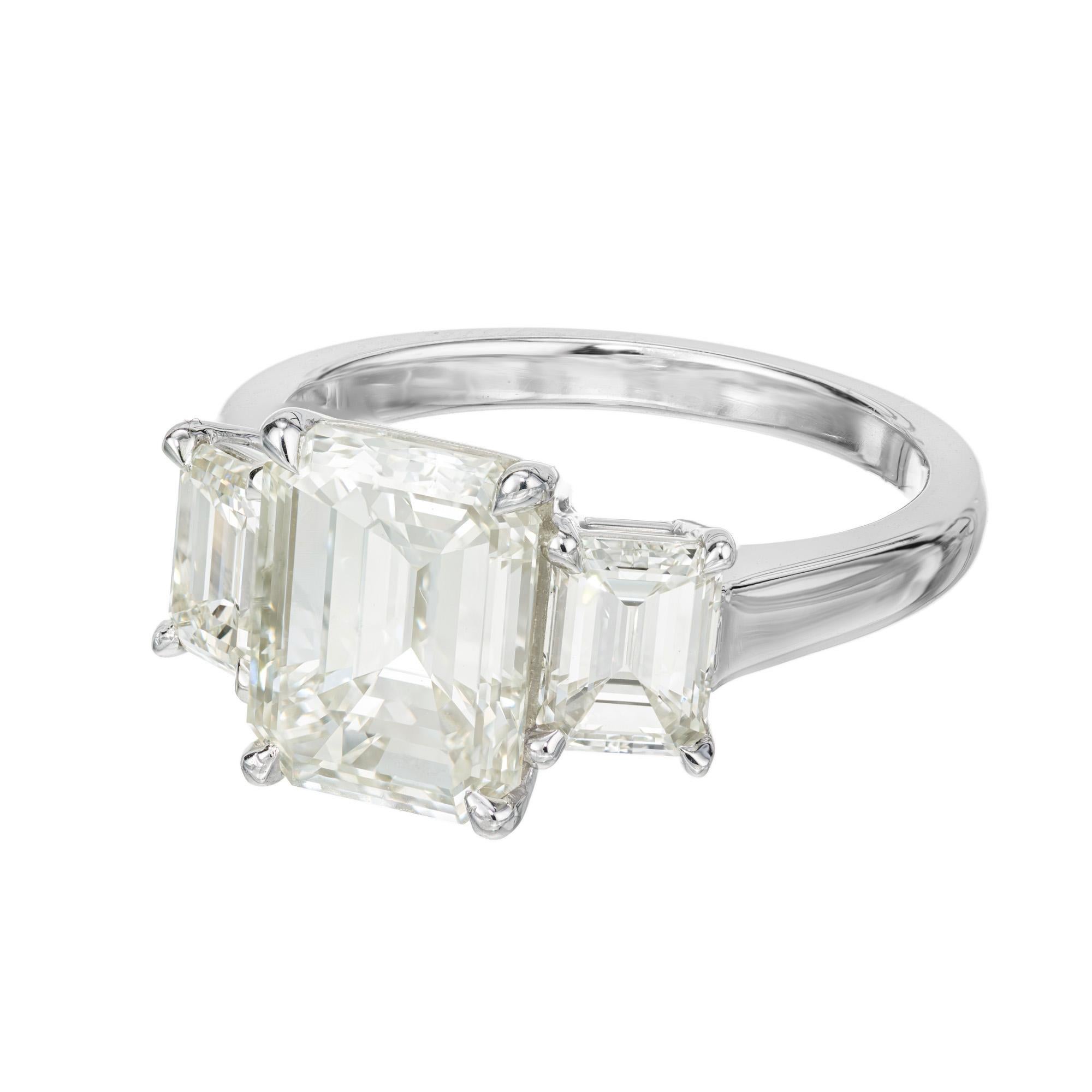 Classic three stone emerald cut diamond ring. 3.00ct emerald cut center stone mounted in a platinum setting accented with one .63ct and one .58ct. All three stones are independently GIA certified and excellent match for cut, color and clarity. They