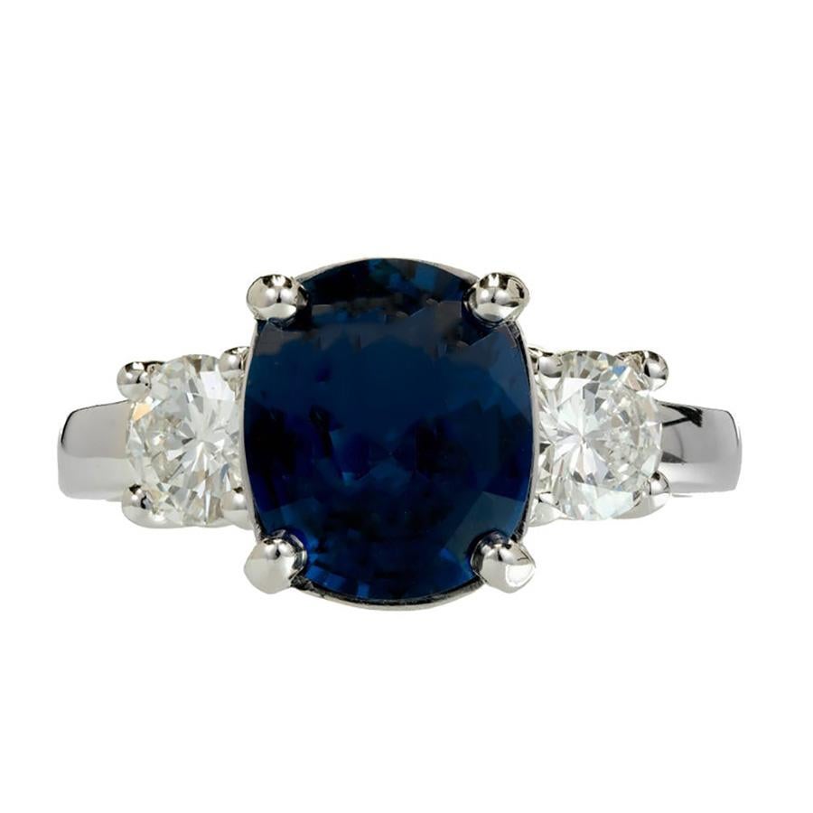 Peter Suchy Platinum Sapphire Diamond engagement ring. Simple but stunning, this ring begins with a GIA certified blue oval 3.24ct Sapphire graded as natural blue Sapphire simple heat only, no other enhancements. The stone is accented by 2 bright