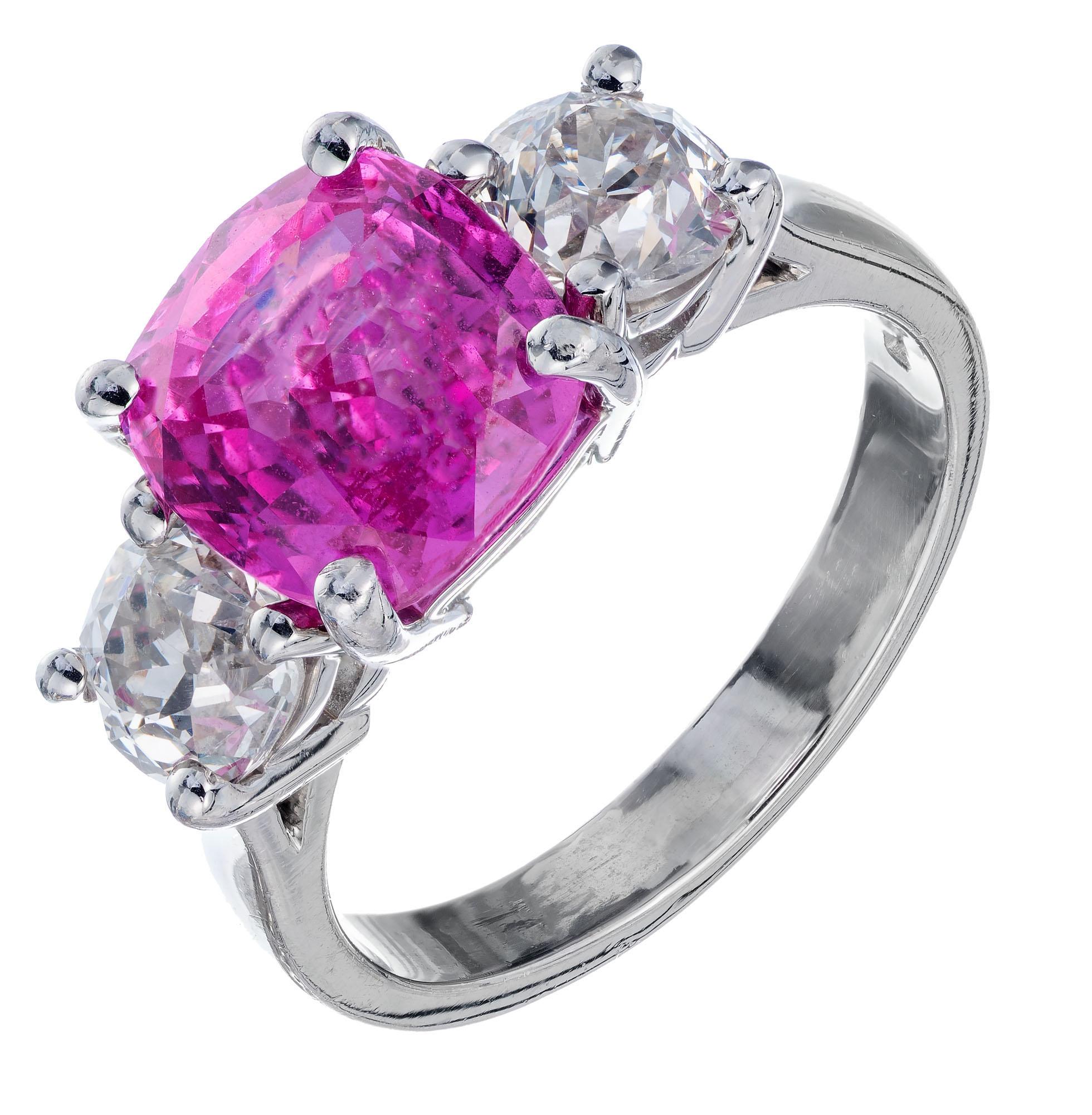 Cushion pink sapphire and diamond engagement ring. GIA certified simple heat only center sapphire with two round accent diamonds in a platinum three-stone setting from the Peter Suchy Workshop.

1 cushion cut natural pink sapphire no heat 4.02cts.