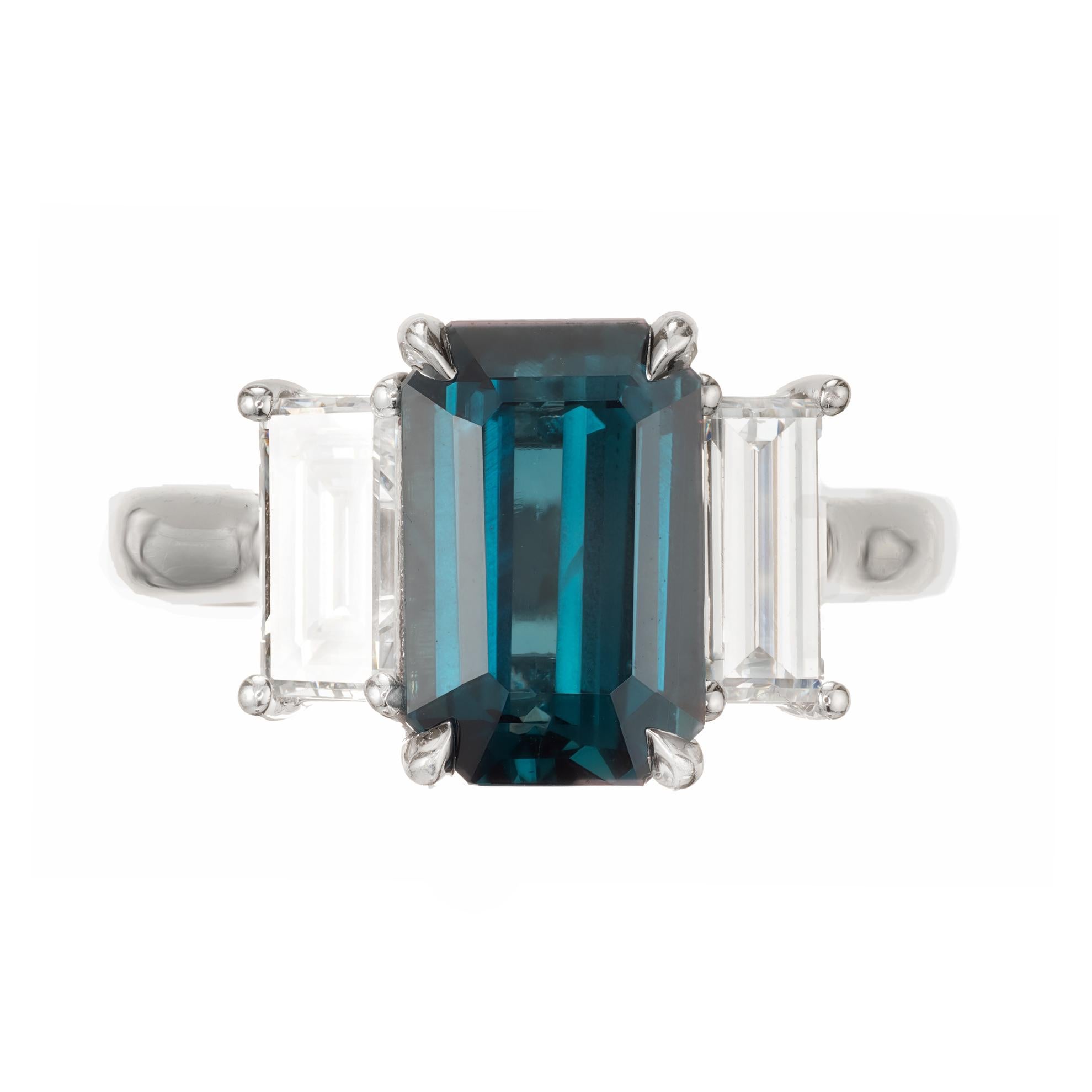 Peter Suchy Sapphire and diamond three stone platinum engagement ring. Made with elongated Emerald cut natural no heat Sapphire and diamonds in a low to the finger platinum setting. Designed in the Peter Suchy Workshop. 

1 octagonal step cut blue