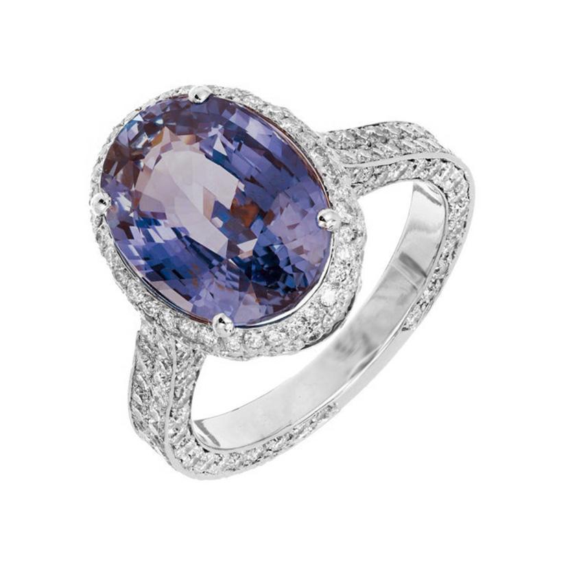 Sapphire and diamond engagement ring. Created in the Peter Suchy Workshop, this GIA certified 6.46 carat oval bright blue periwinkle sapphire mounted in diamond halo 18k white gold setting. This beautiful oval sapphire is certified by the GIA as
