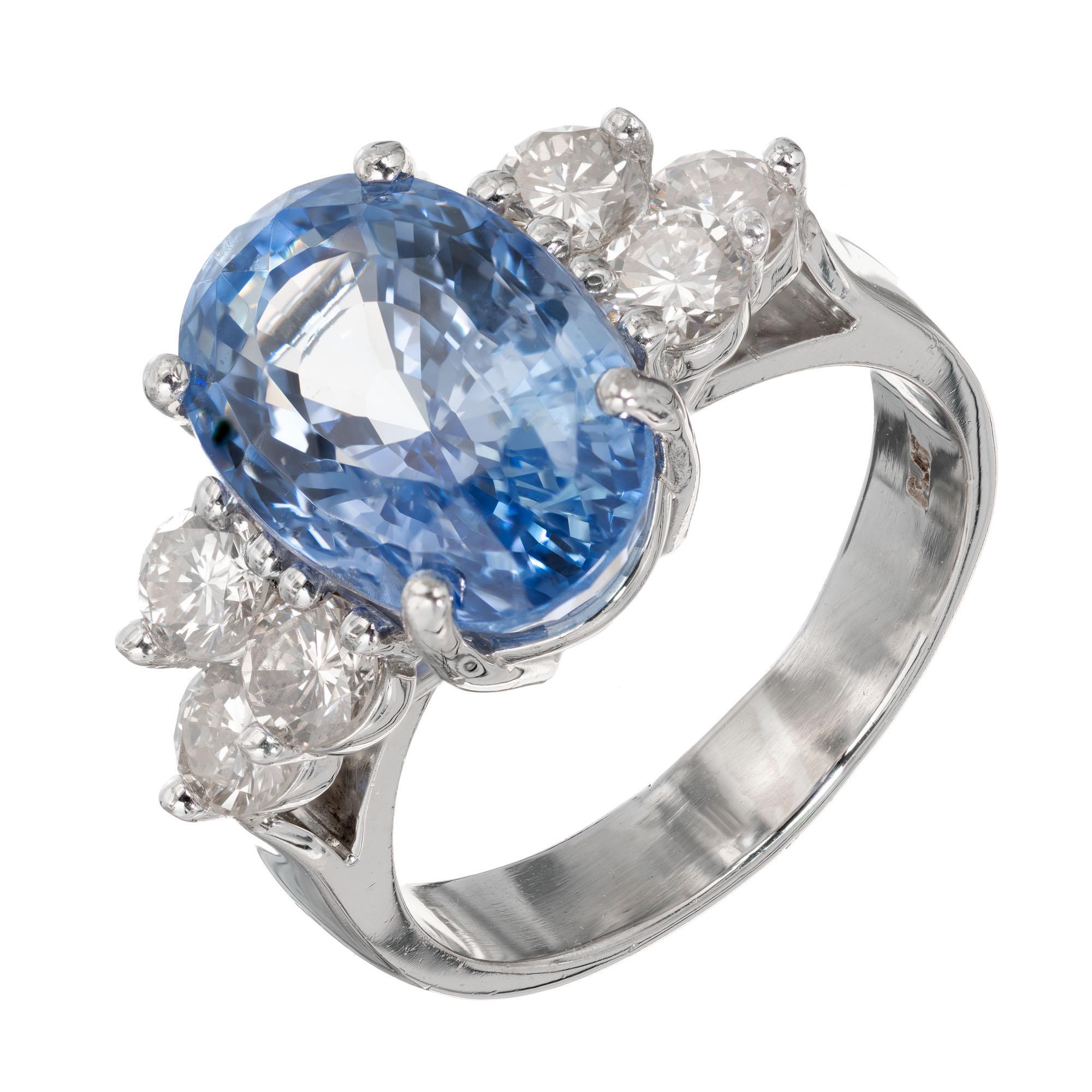 Sapphire and diamond engagement ring. Natural no heat no enhancements periwinkle blue center oval sapphire with six side diamonds, in a platinum setting from the Peter Suchy workshop. 
    
1 oval 8.95ct natural no heat no enhancement blue Sapphire