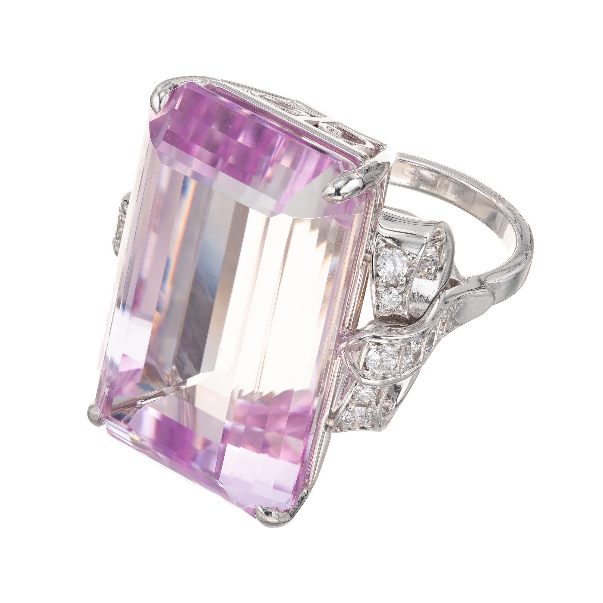 47.45 carat center kunzite and diamond cocktail ring. Emerald step cut light bright pink center stone with 20 round brilliant cut pave set accent diamonds in a 18k white gold bow style setting, from the Peter Suchy Workshop. Double certified with a