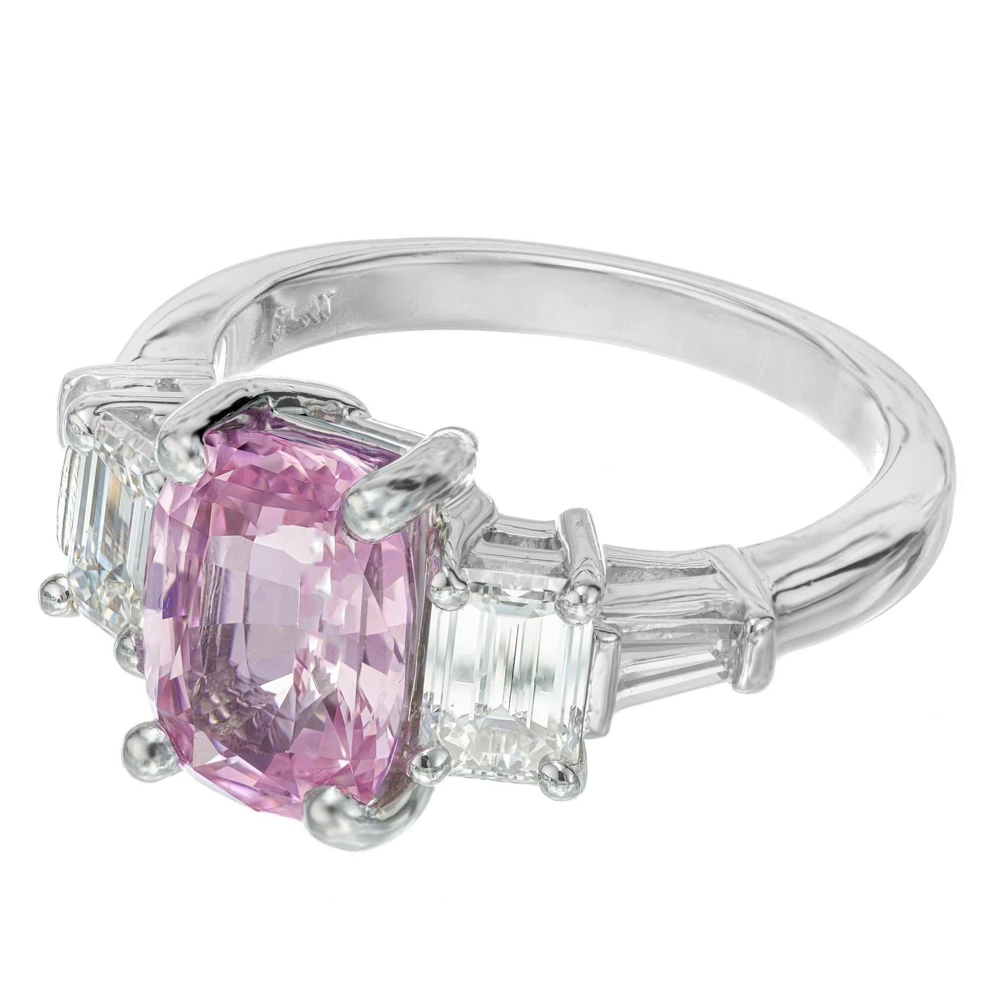 Natural purple pink sapphire and diamond engagement ring. GIA certified natural, untreated cushion cut center Sapphire in a platinum setting with 2 emerald and 2 tappered baguette side diamonds. The ring was designed in the Peter Suchy Design
