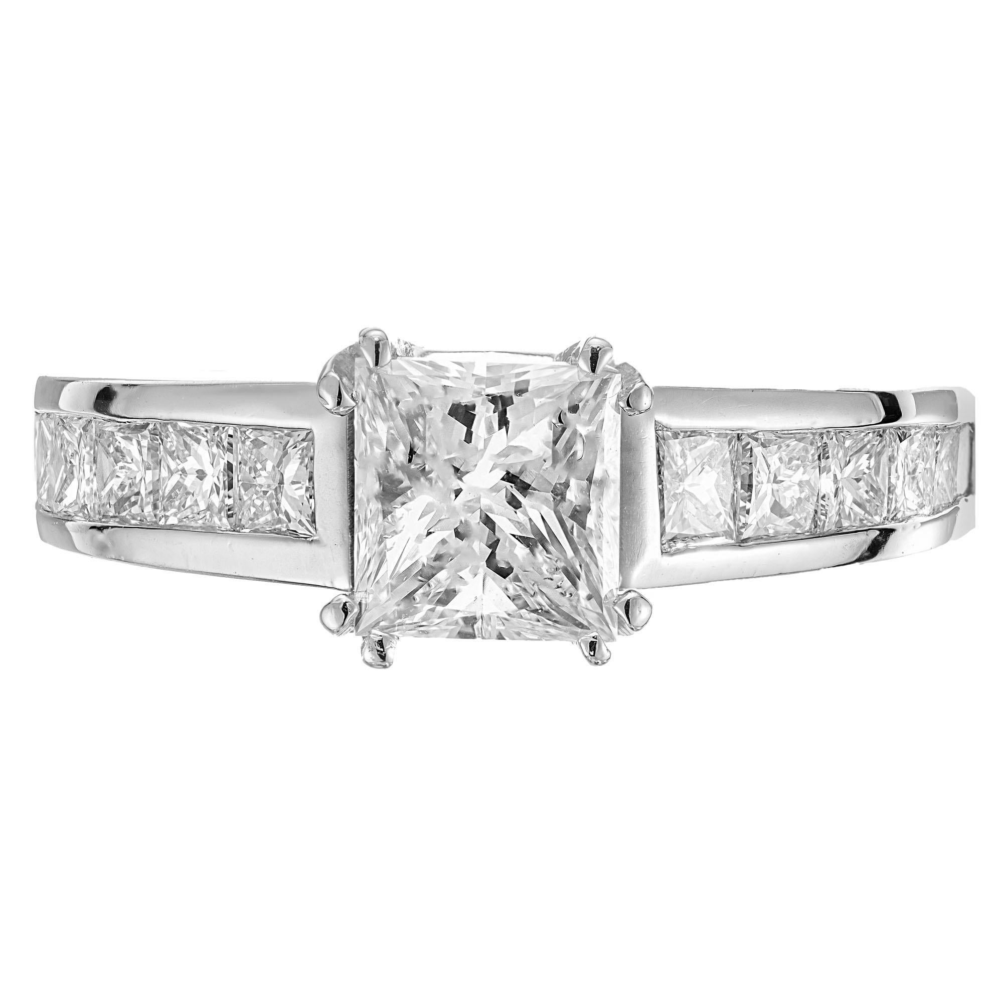 Diamond engagement ring. GIA certified princess cut diamond center stone set in platinum with 12 princess cut accent diamonds. Designed and crafted in the Peter Suchy workshop.

1 princess cut diamond, D VS2 approx. 1.00cts GIA Certificate #