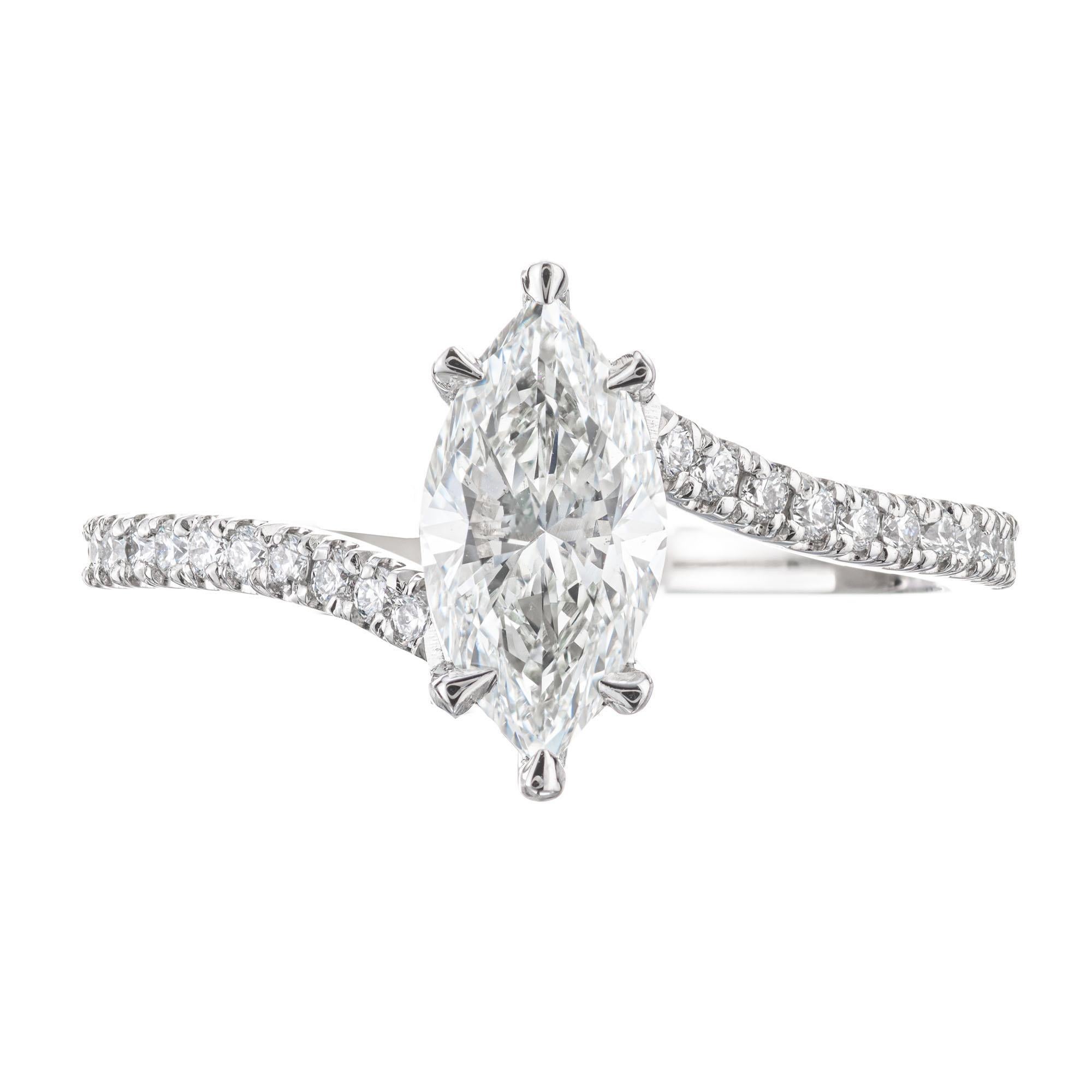 Marquise cut diamond engagement ring. GIA certified 1.01 center diamond in a solitaire bi-pass style platinum setting with 36 round brilliant cut accent diamonds along the shank.  Created in the Peter Suchy Workshop. 

1 marquise brilliant cut