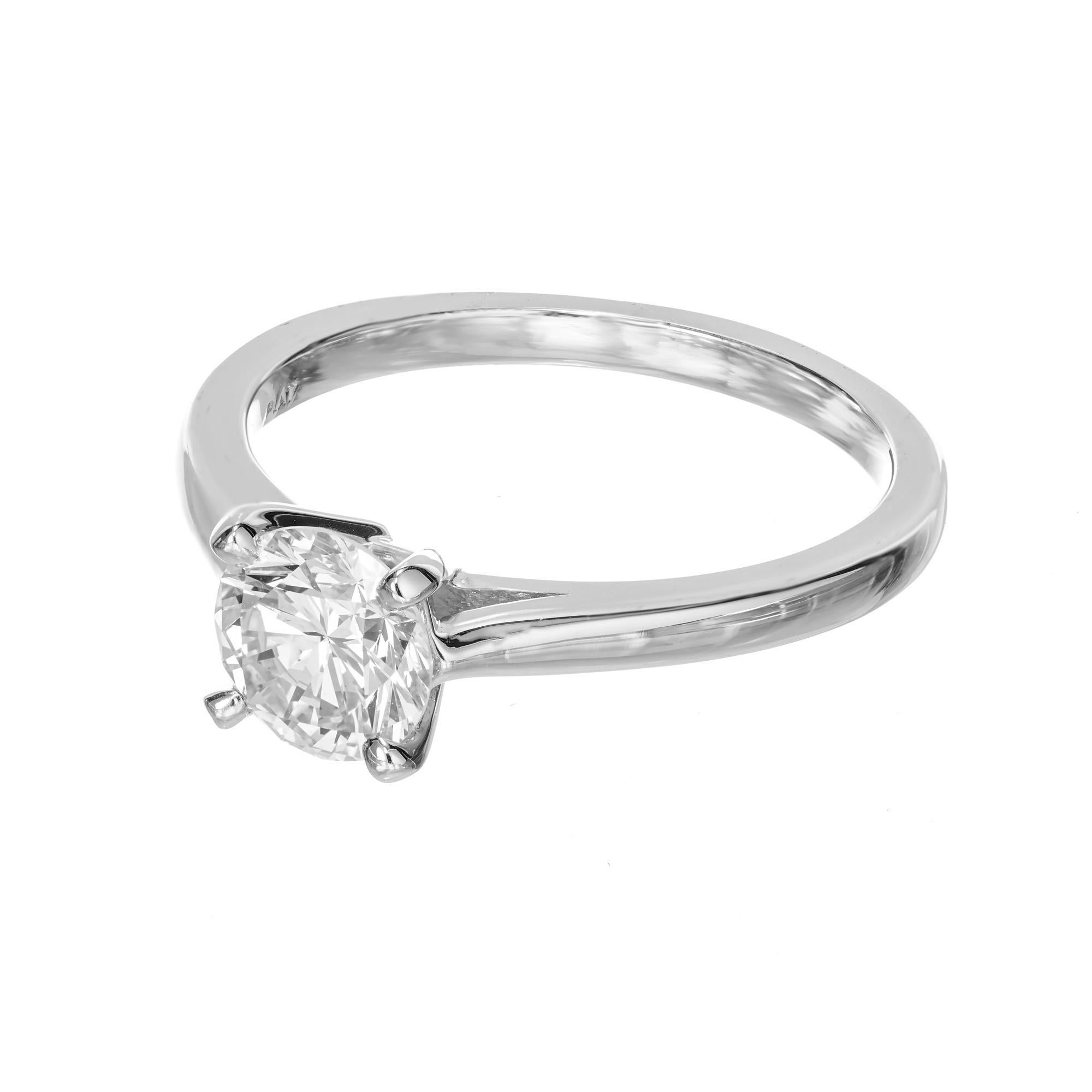 Simple, classic engagement ring with a few special features. First, the diamond is set low to the finger for comfort and safety. Second, the ring is engineered to safely remove the cross bar at the north and south sides of the ring. This allows